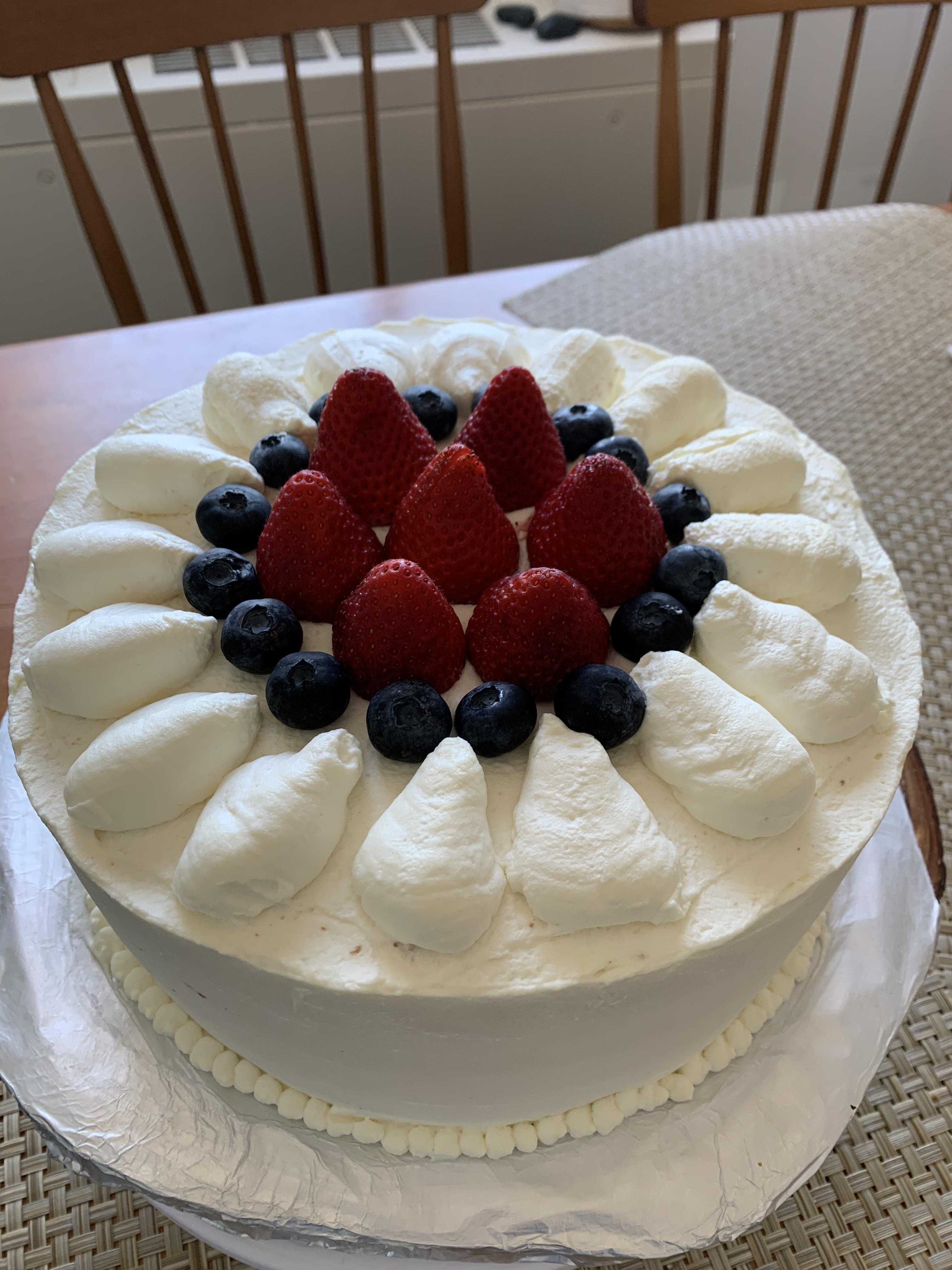 The beautiful strawberry fruit cake with whipped cream frosting that
