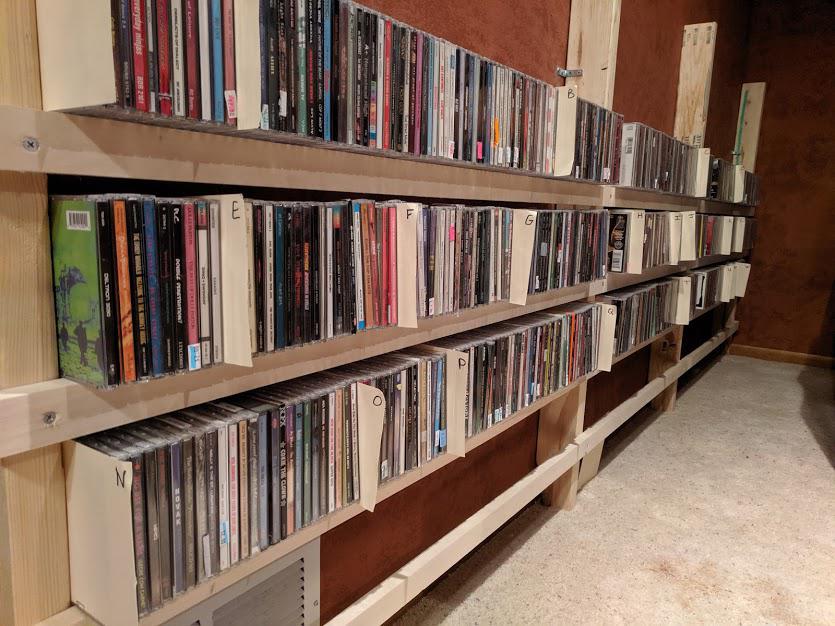 Built a shelf to hold all CDs. Cost about 40 holds well over 4,000 CDs