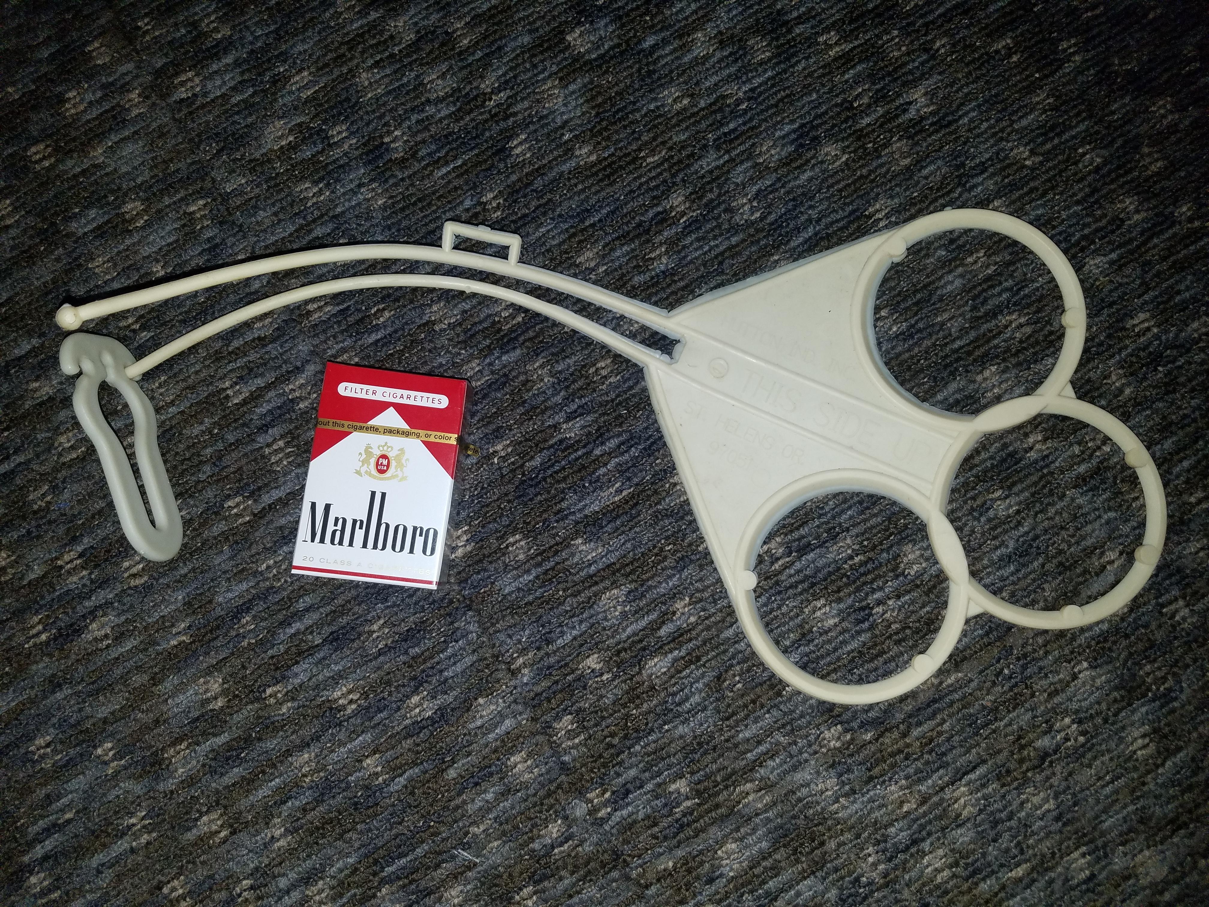 Rubber strap thing, says THIS SIDE UP and HUTTON IND. INC., ST. HELENS