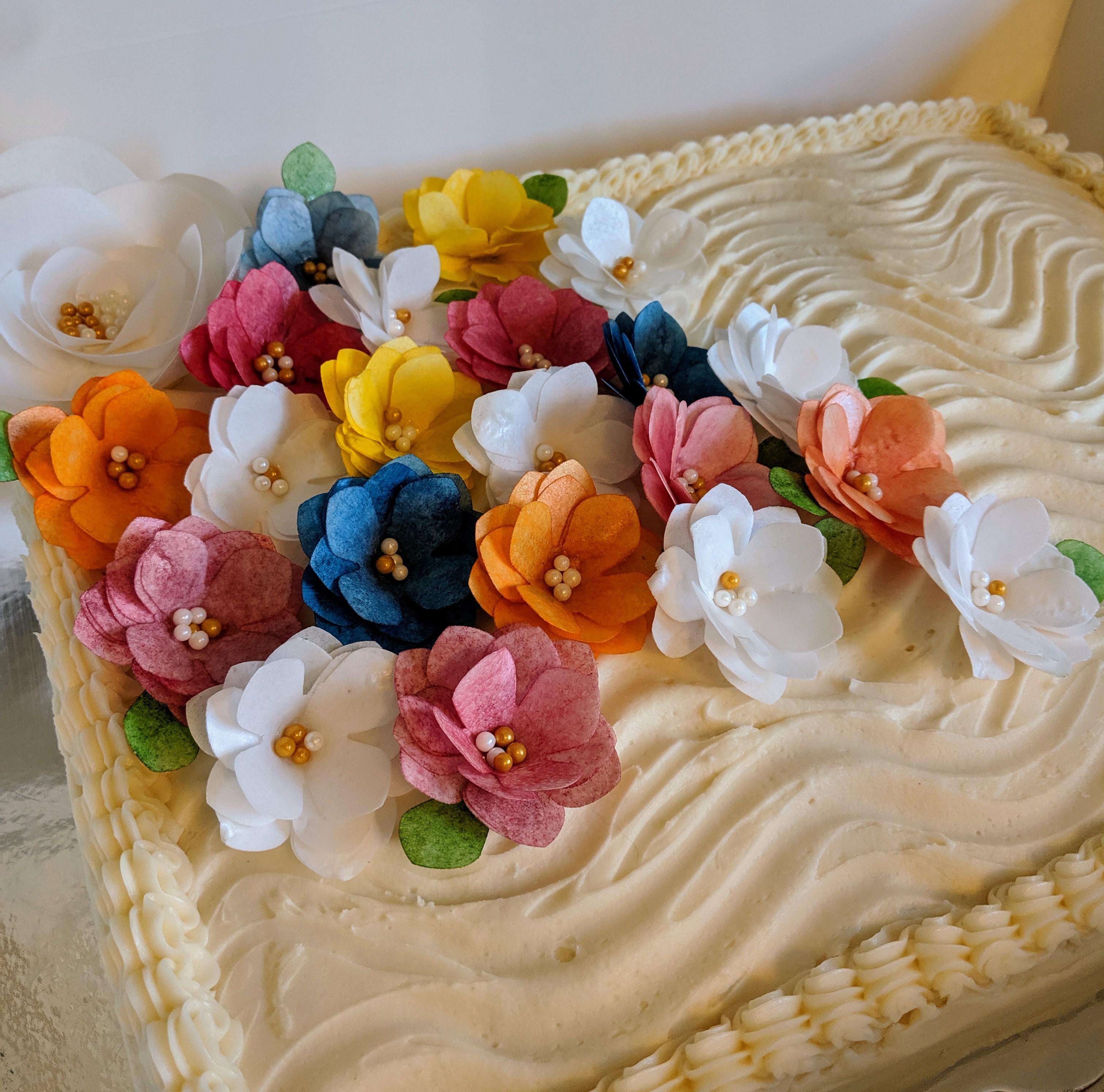 Spend 2 hours making wafer paper flowers for a baby shower cake. I'm so
