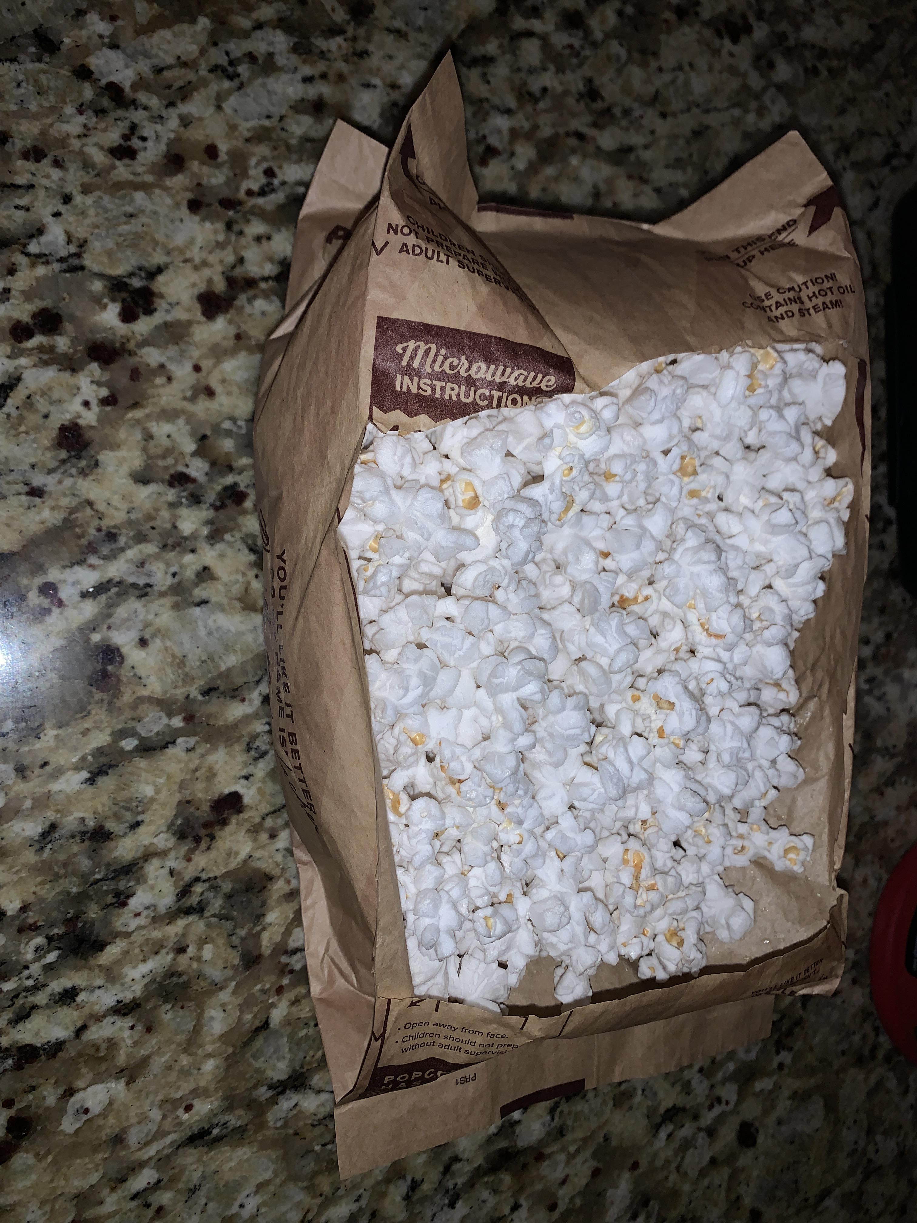 Open your microwave popcorn by cutting the top of the bag! No need to