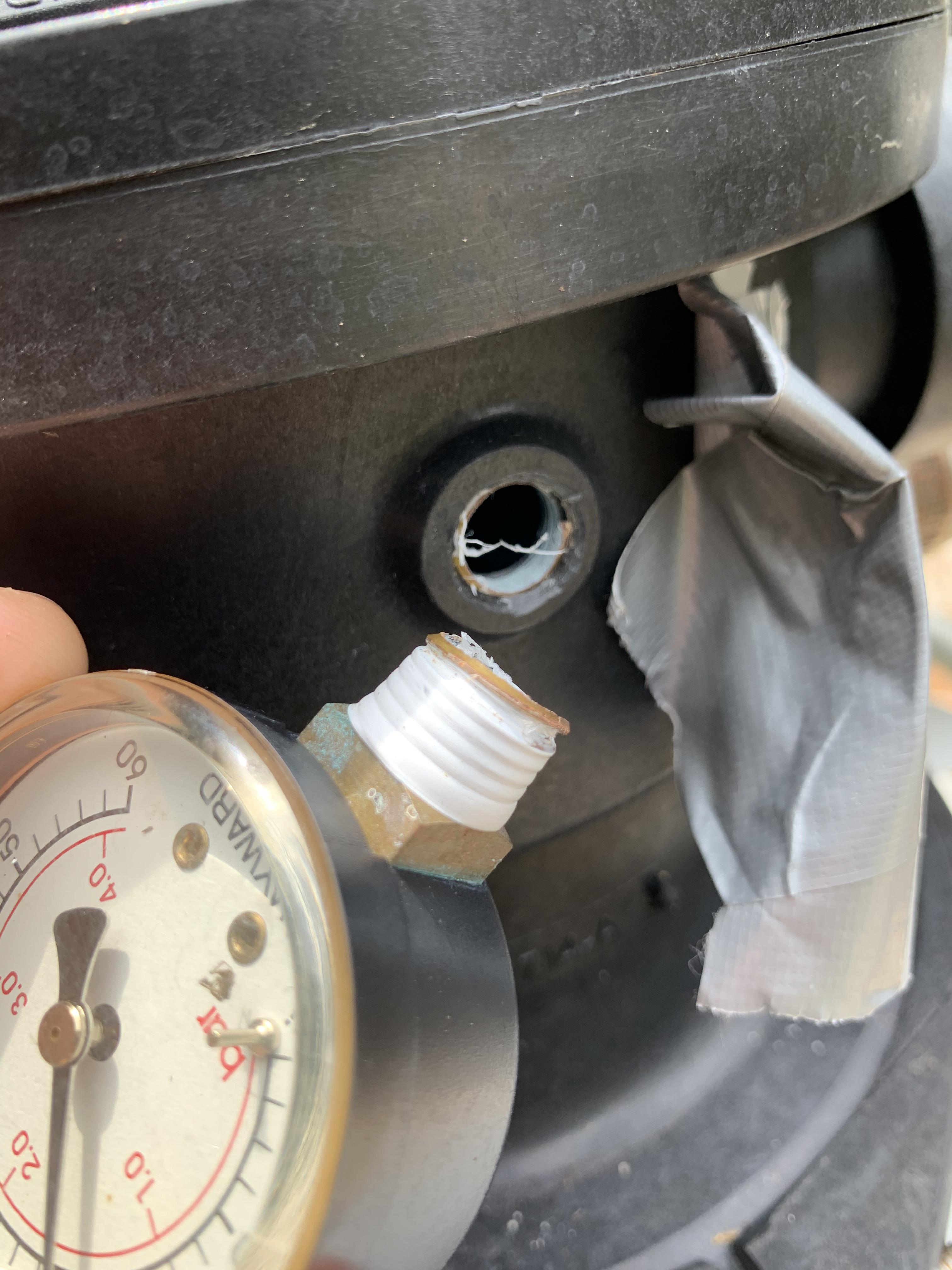 What kind of tool can I use to remove the segment of threaded pipe that is stuck in that hole