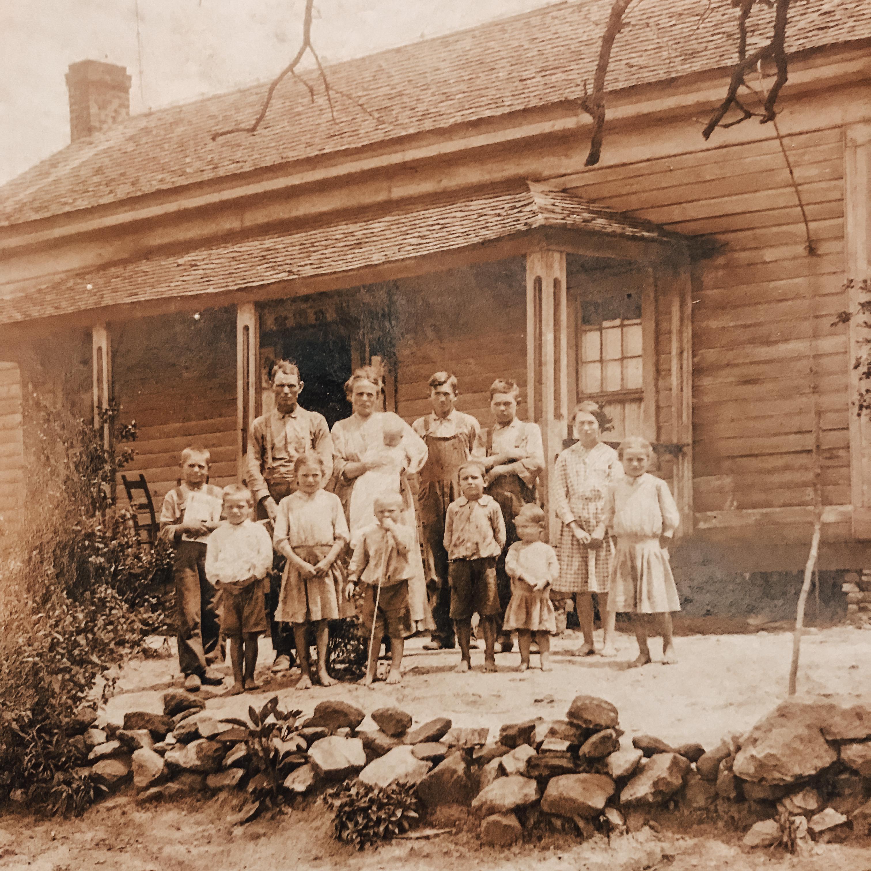 My great great great grandparents in front of their house. This home