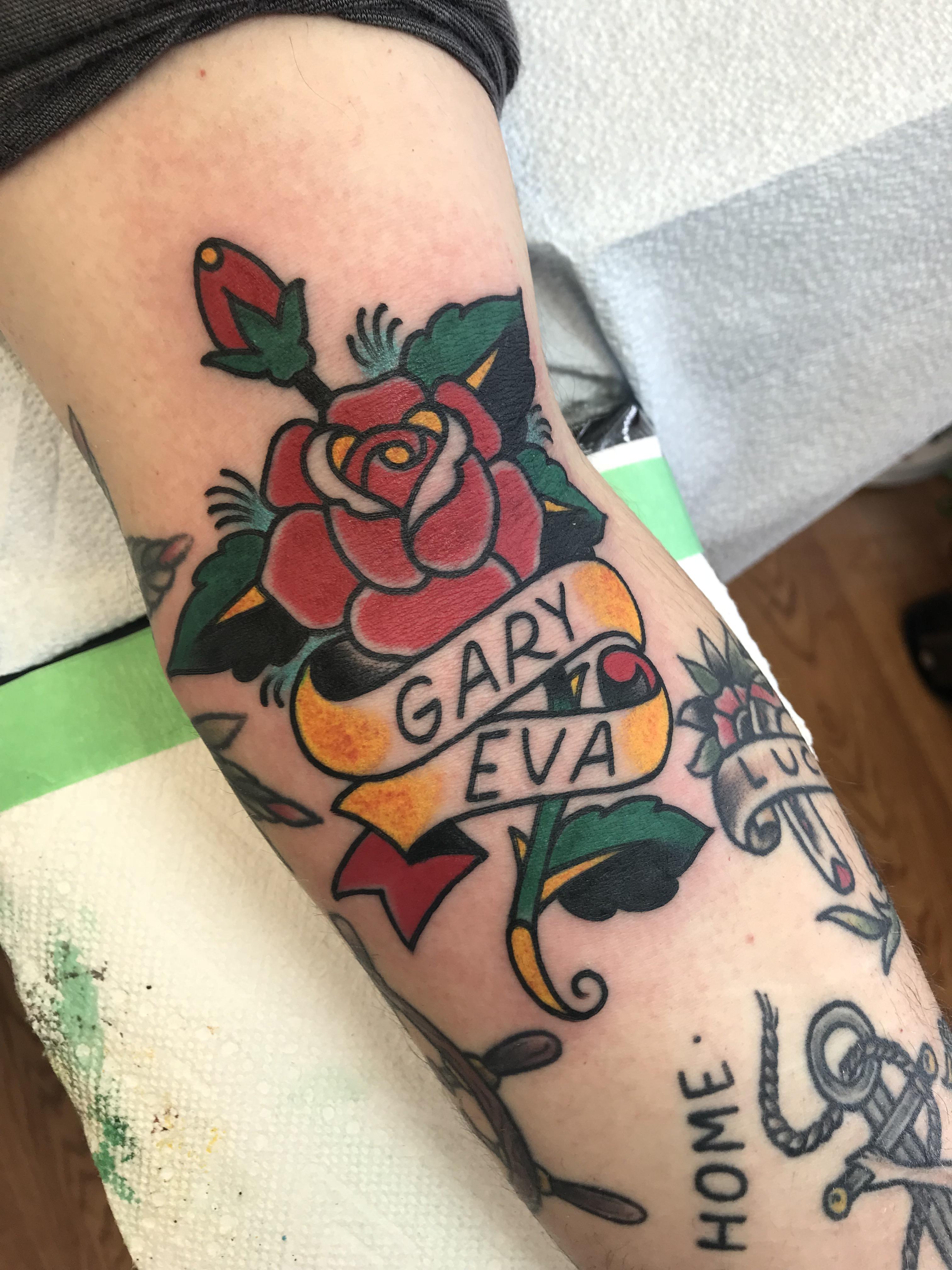 Rose with kids names. Done by Nelson at Goldstream Tattoos