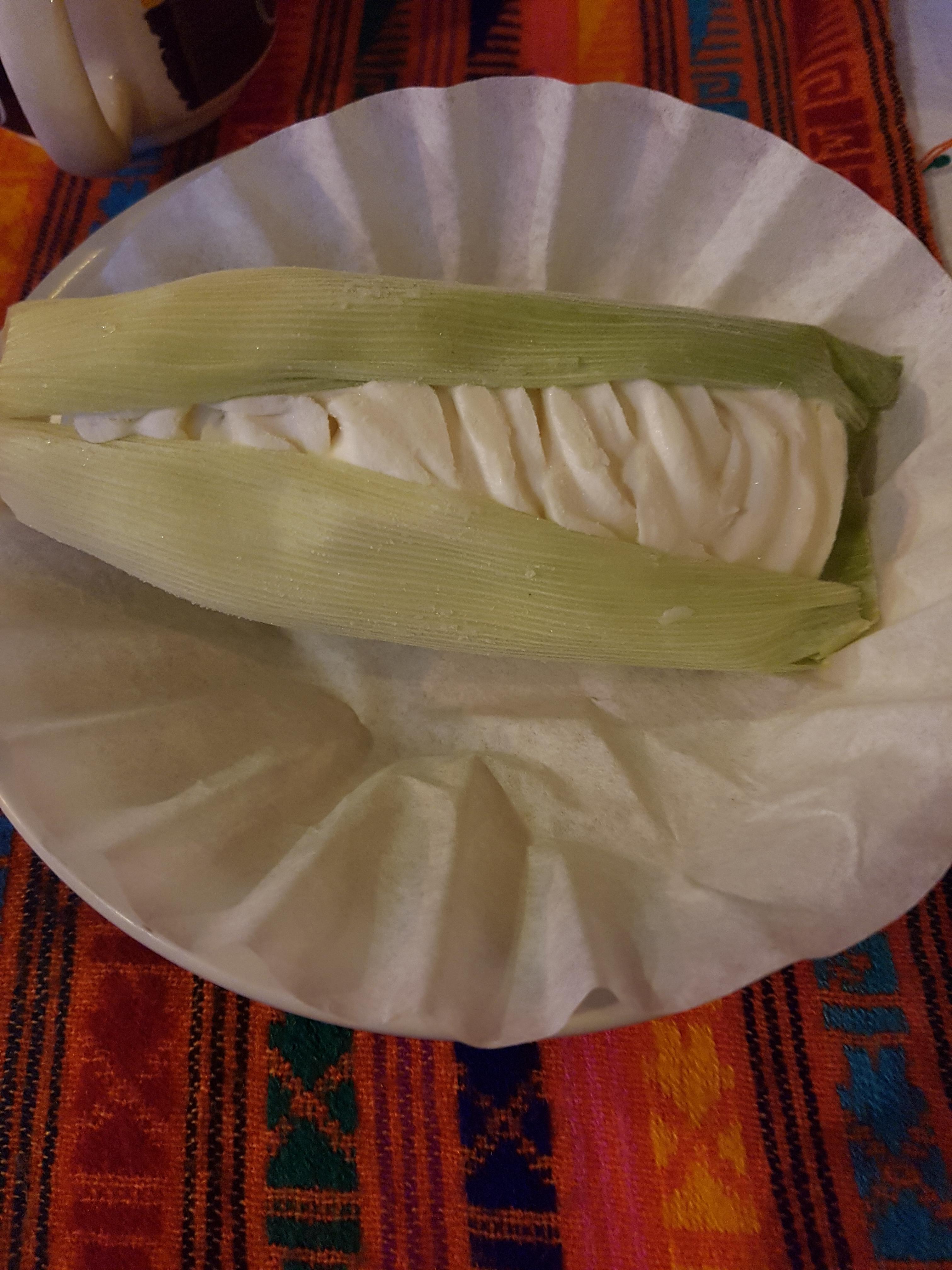 Sweet corn flavoured icecream presented in a corn husk r