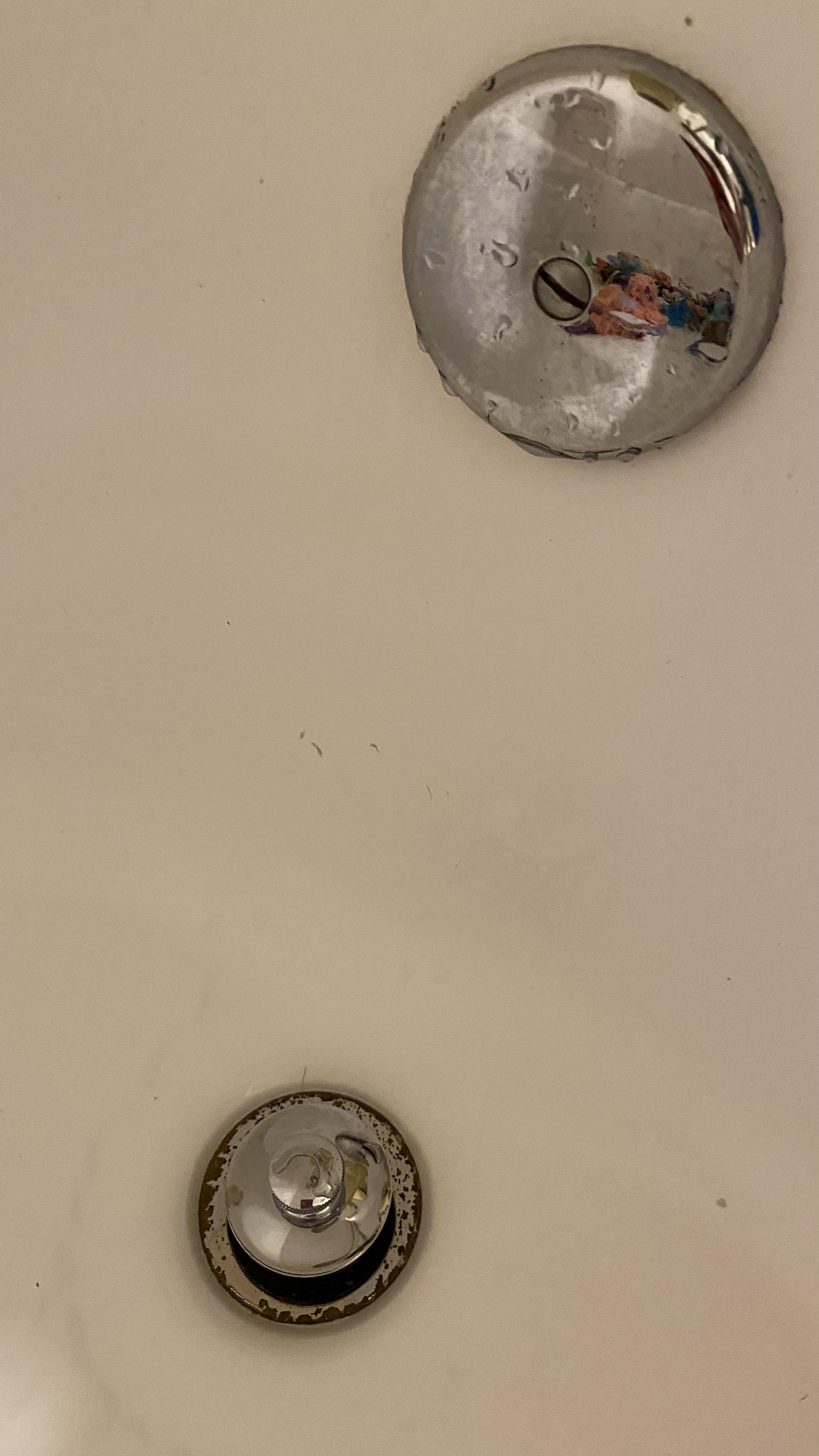 How do you remove this drain plug? You push it in, pull it up. It spins
