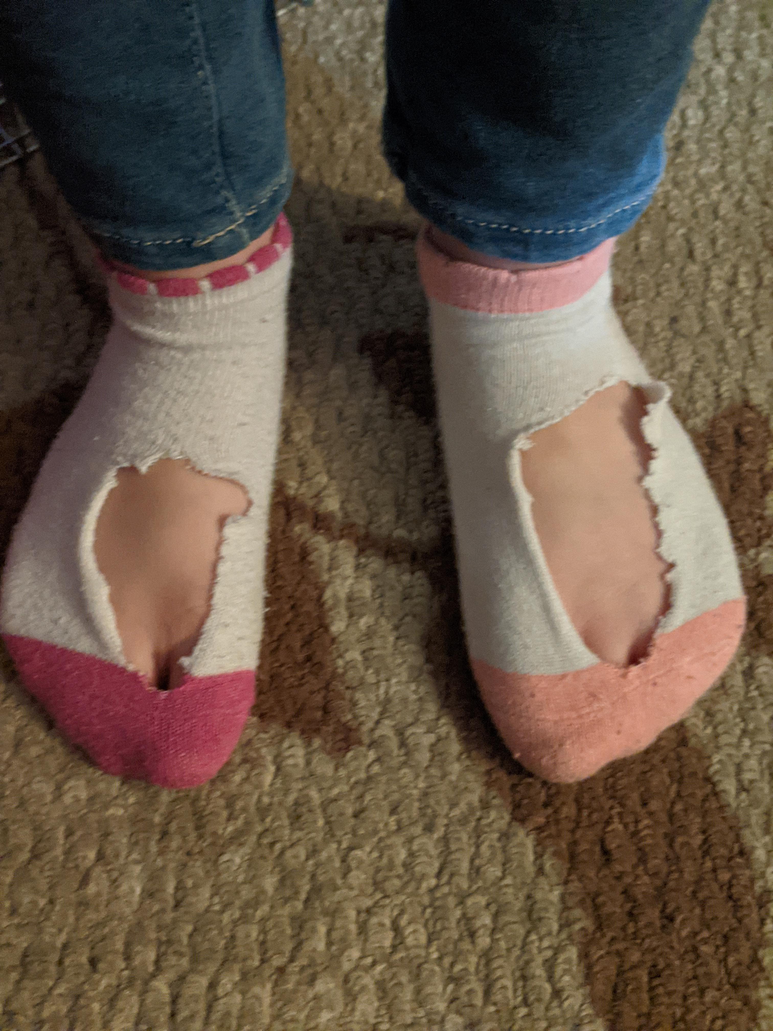 My five year old daughter cut holes in her socks just in case her feet