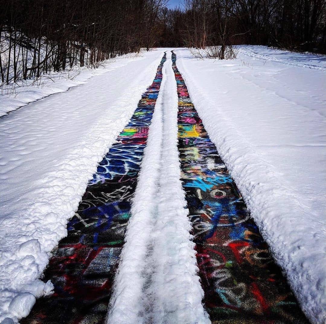 The abandoned graffiticovered highway in Pennsylvania with snow (by
