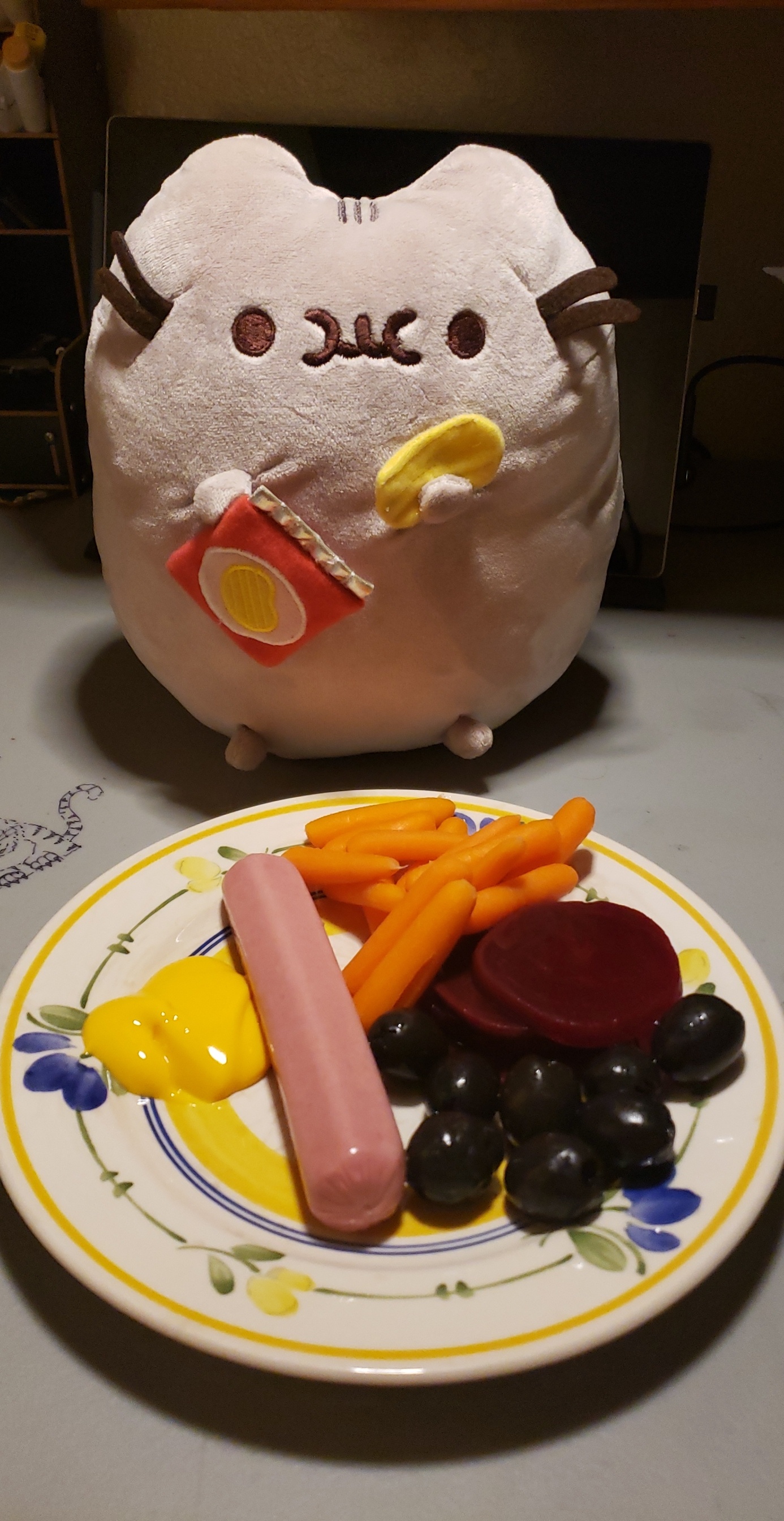 Chicken hot dog, carrots, pickled beets, and black olives with mustard