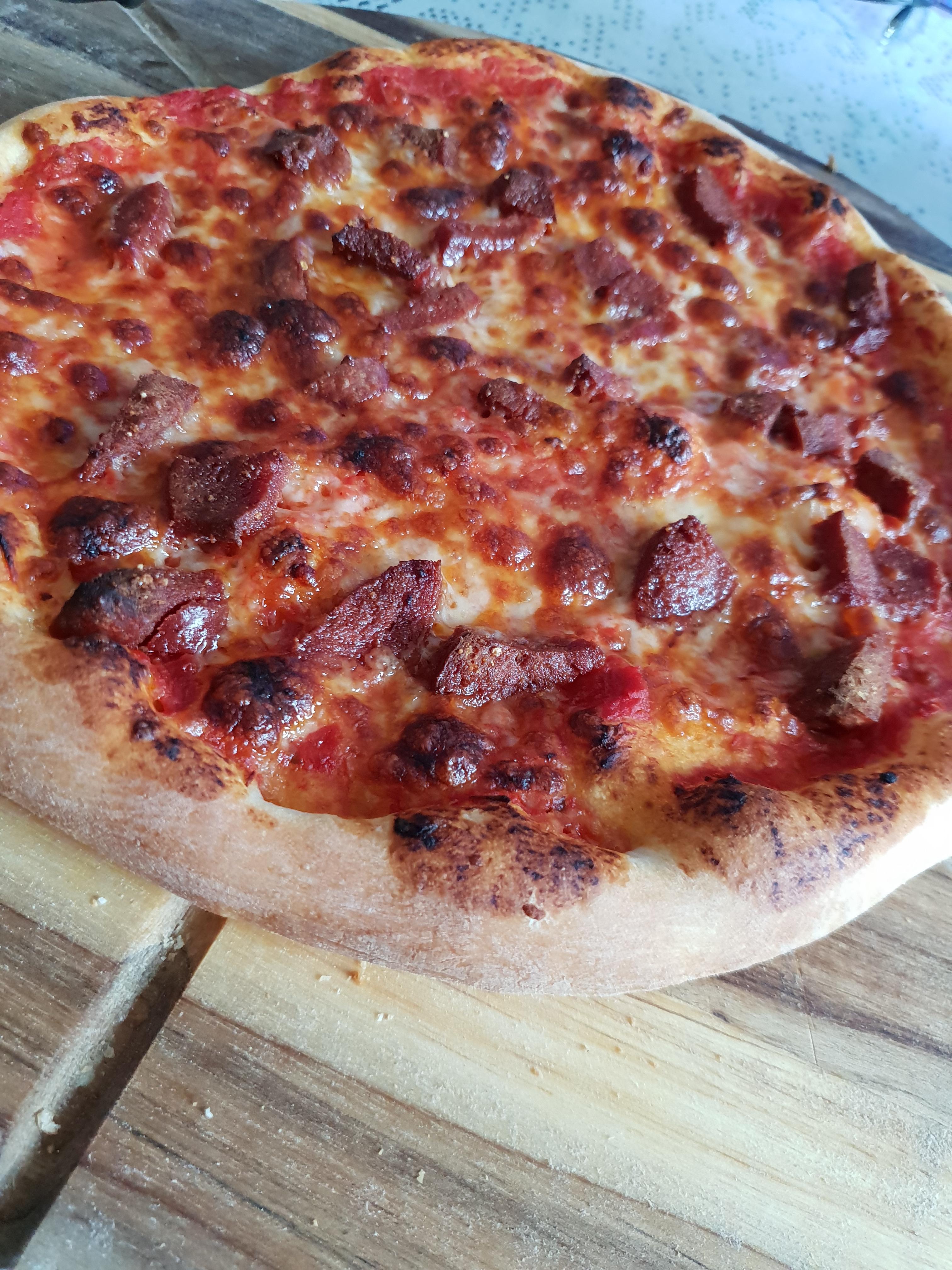 Made a pizza with some spicy turkish sausage on it r/Pizza