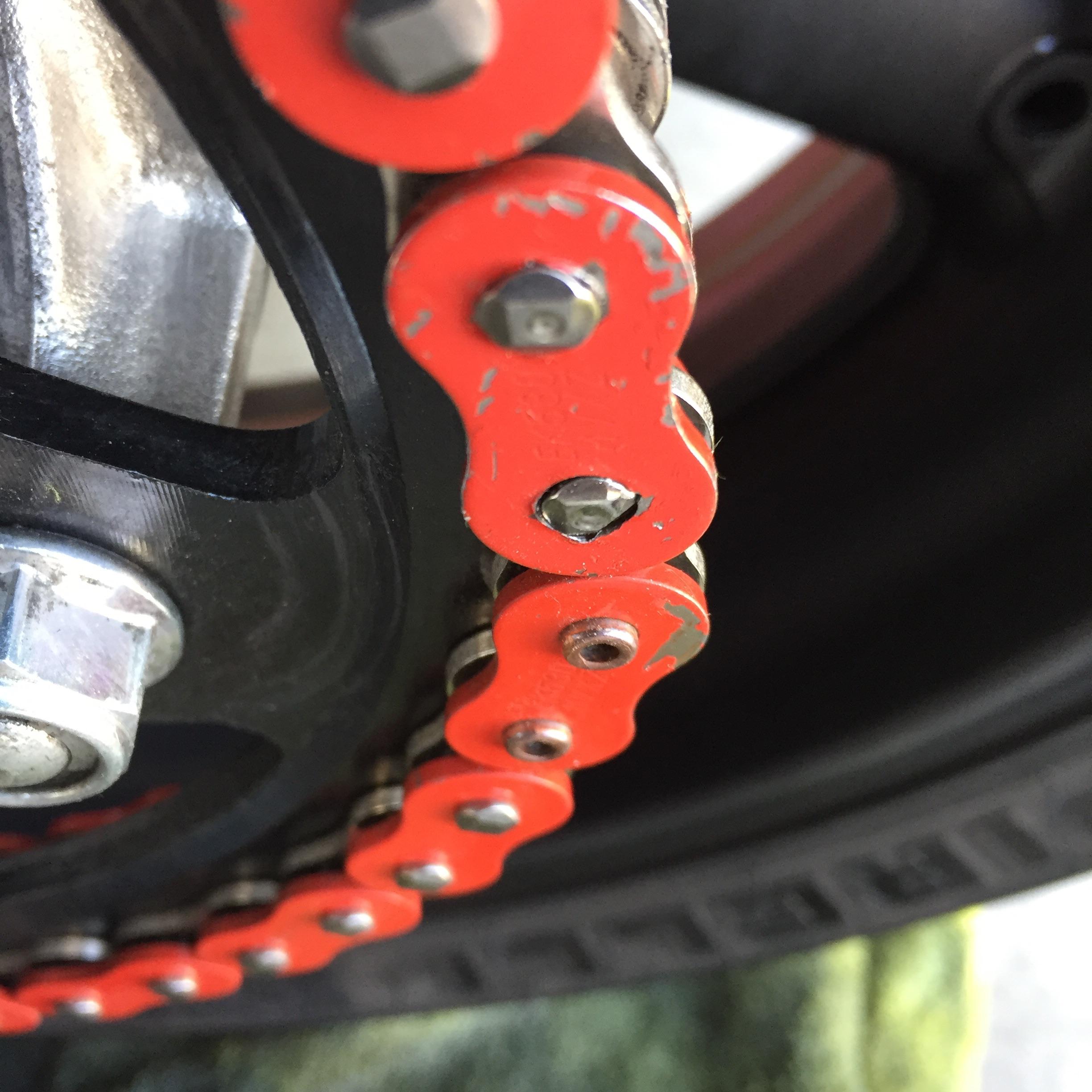 The rivet next to the master link looks bad. What should I do about it? r/motorcycles
