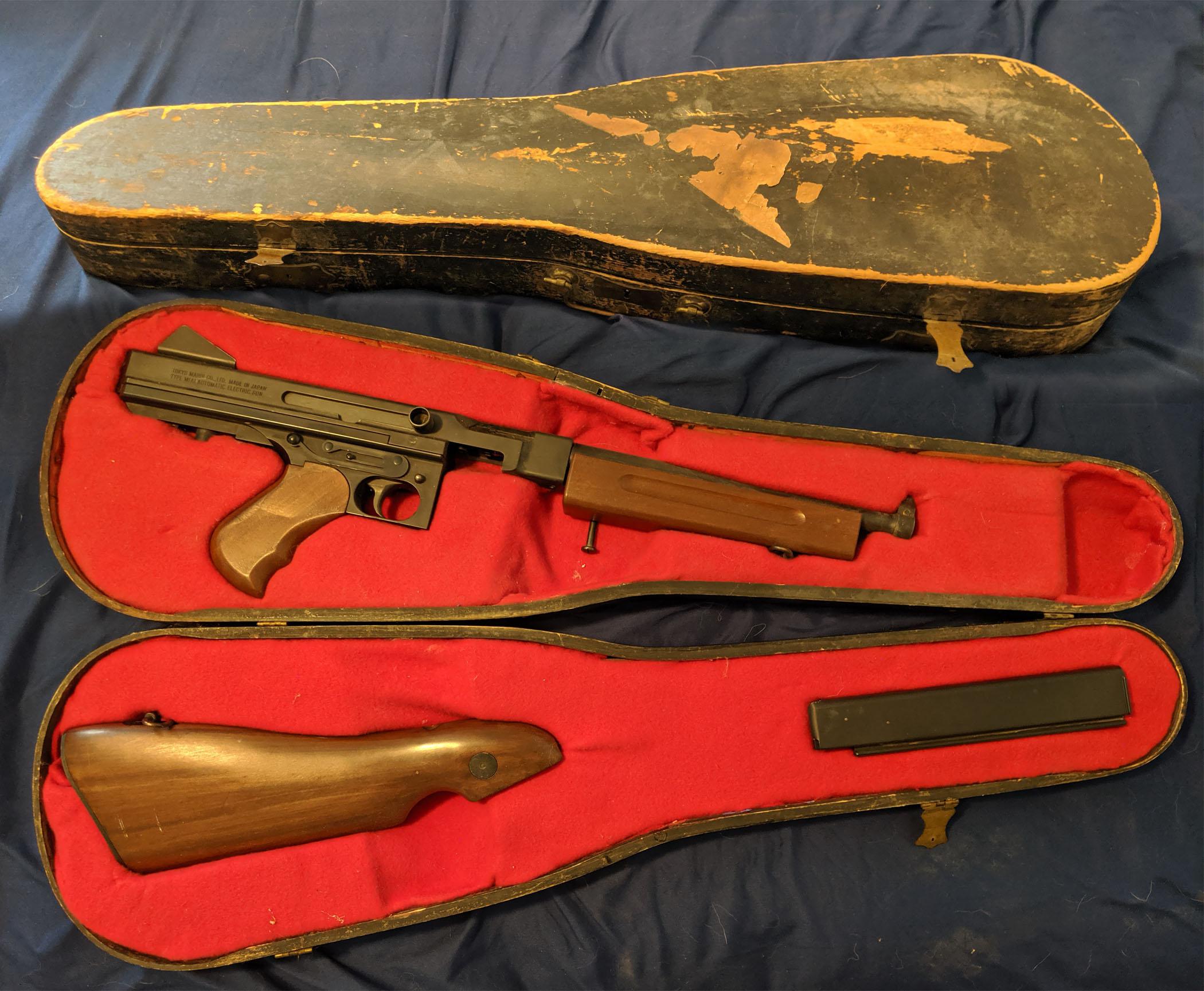 My 15 year old TM Thompson in it's custom violin case. r/airsoft