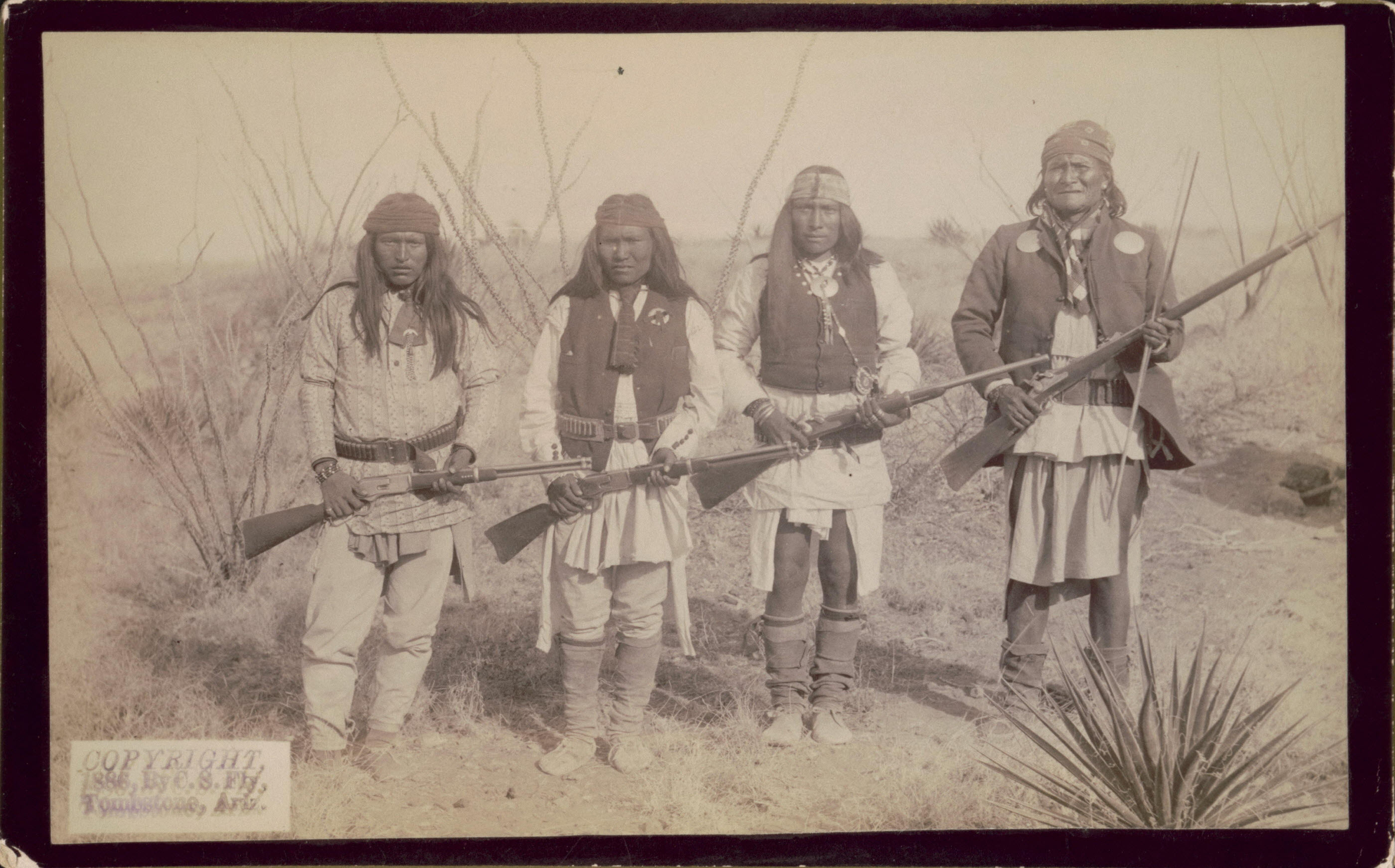 Geronimo standing next to his son and "two picked braves" 188090 r