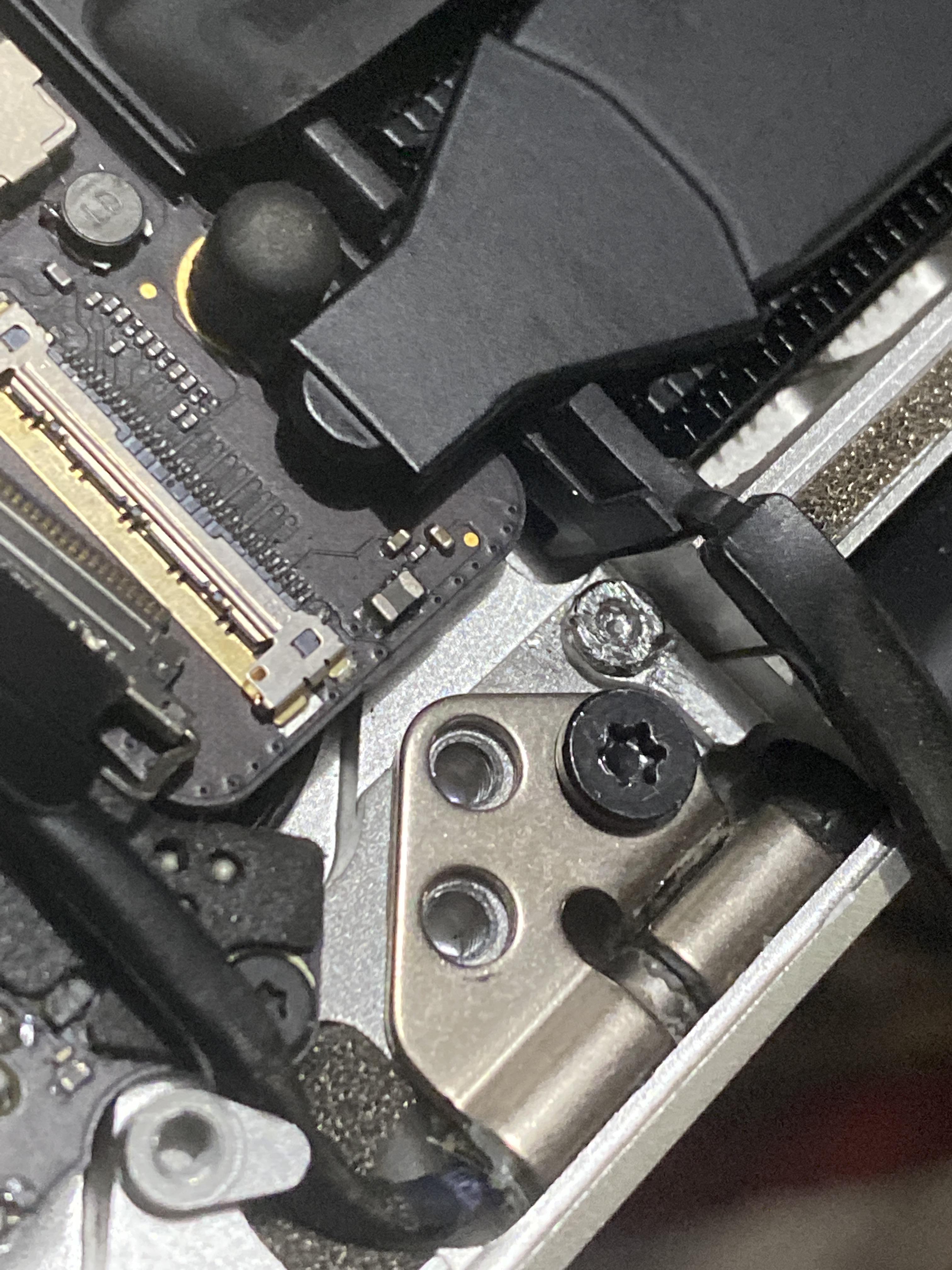 What can I do to remove the stripped screw on this Macbook Pro 15” Mid