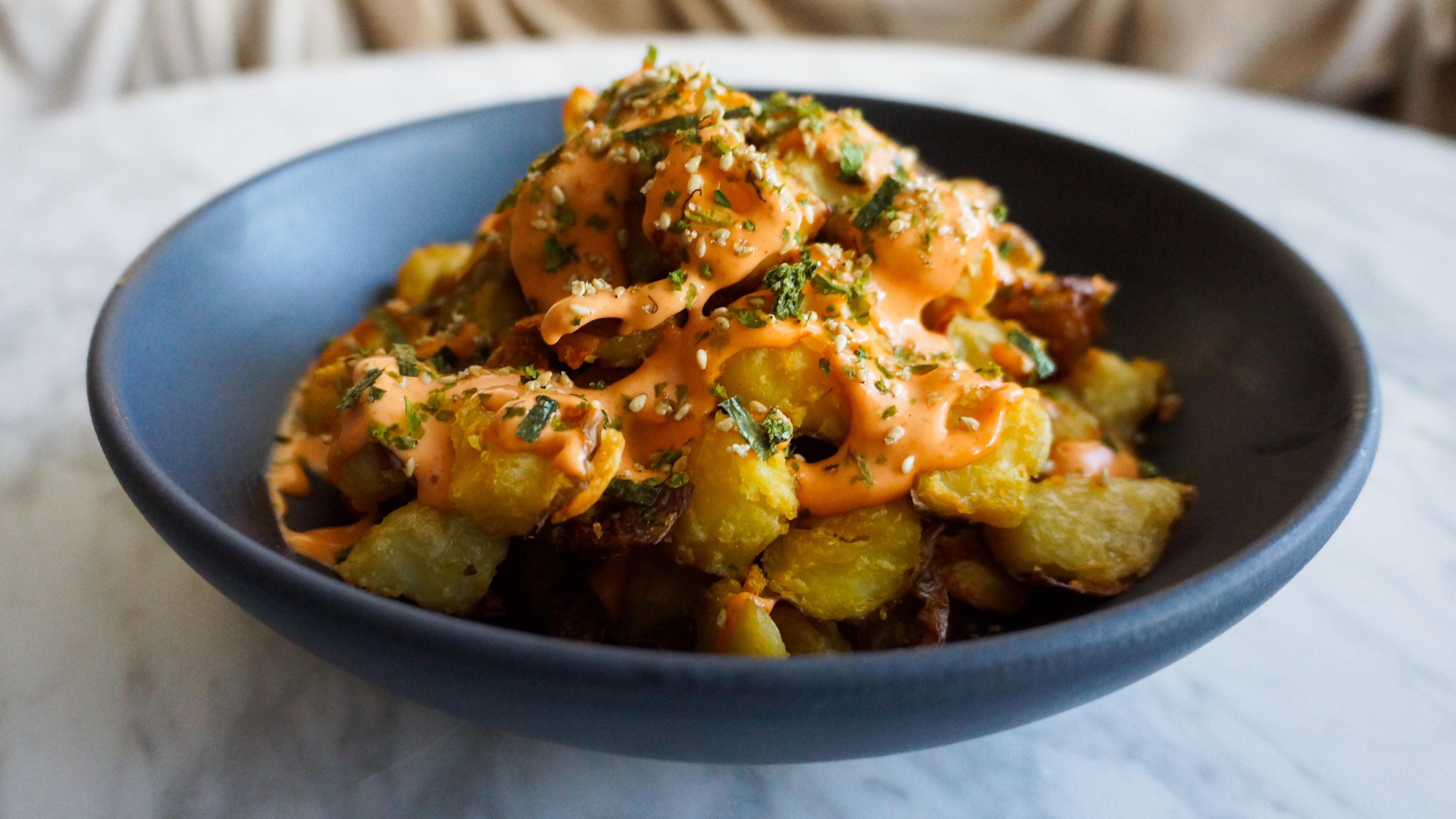 I made Kenji’s crispy roast potatoes topped with sriracha aioli and