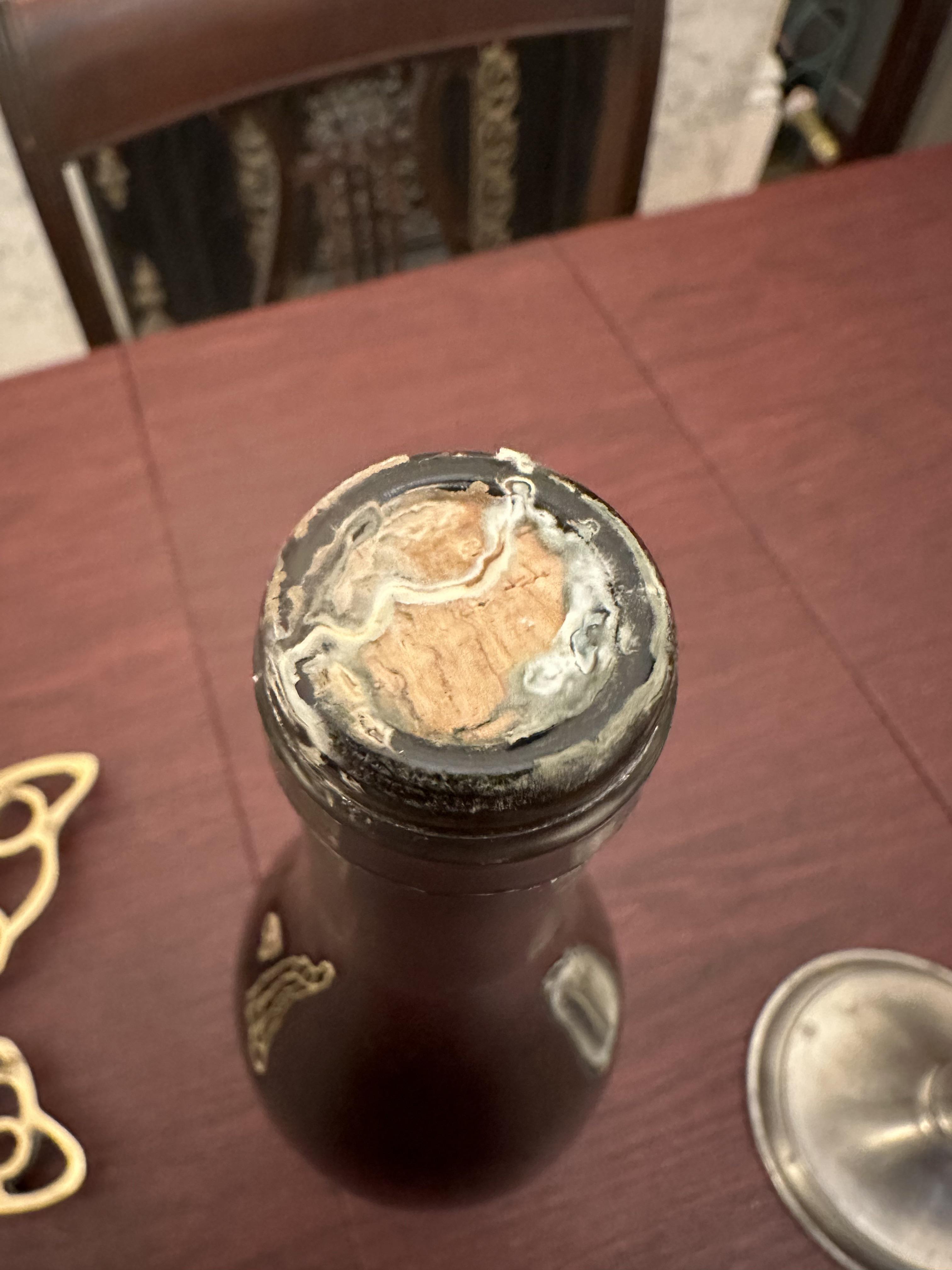 What’s growing on my wine bottle? Moldy cork under the foil. r/mycology