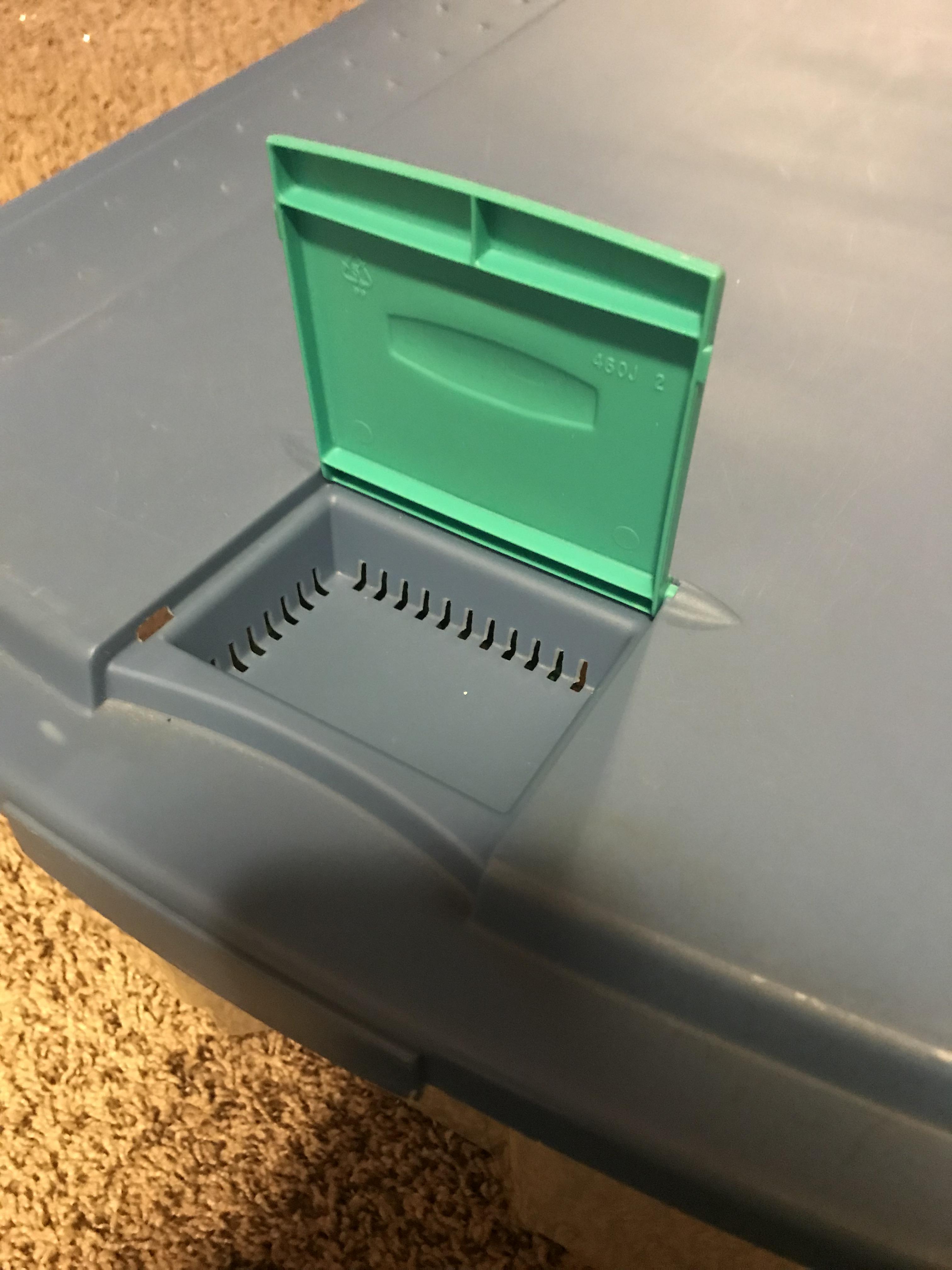 What is this thing found on plastic storage box lid. It opens and