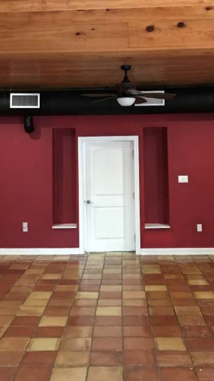 What to put in these tall skinny shelves next to bedroom door. Can’t