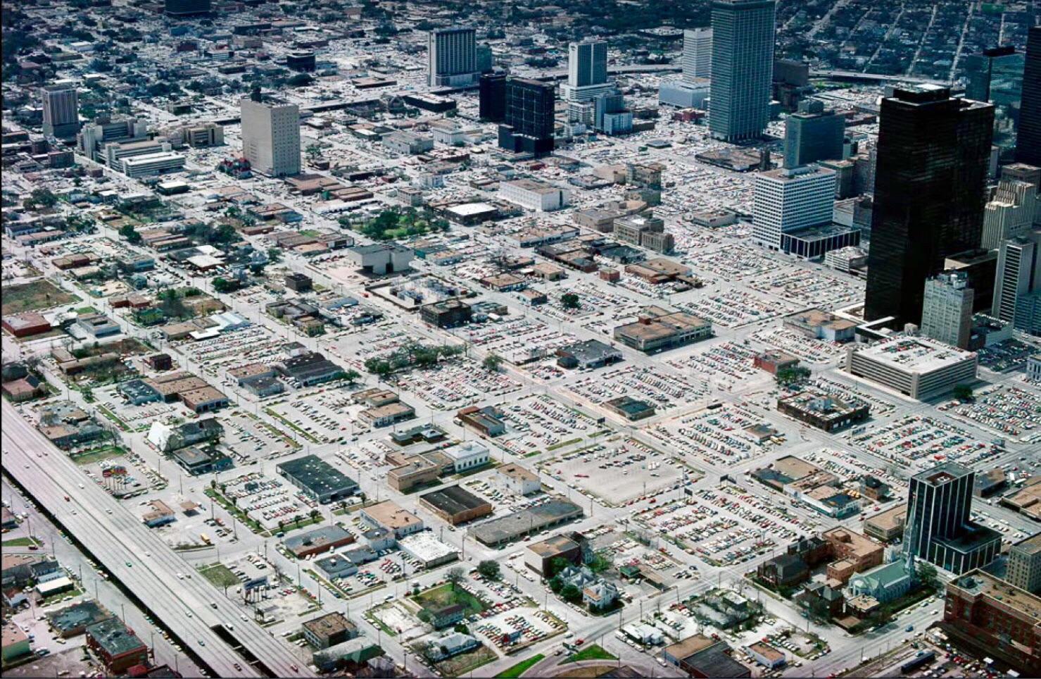 “Downtown” Houston in the 1970’s. Car oriented infrastructure created a bleak and sparse