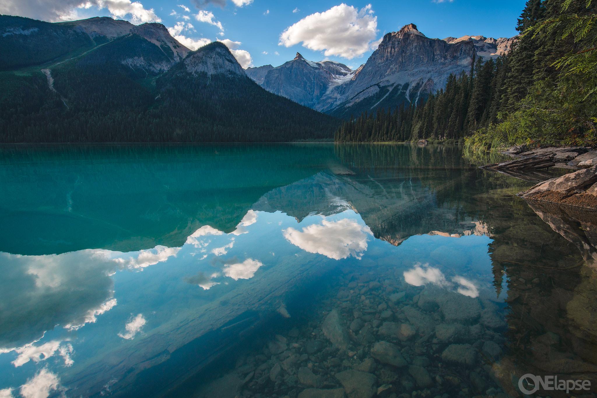 Like a mirror, yet so clear you can see the bottom of Emerald Lake in