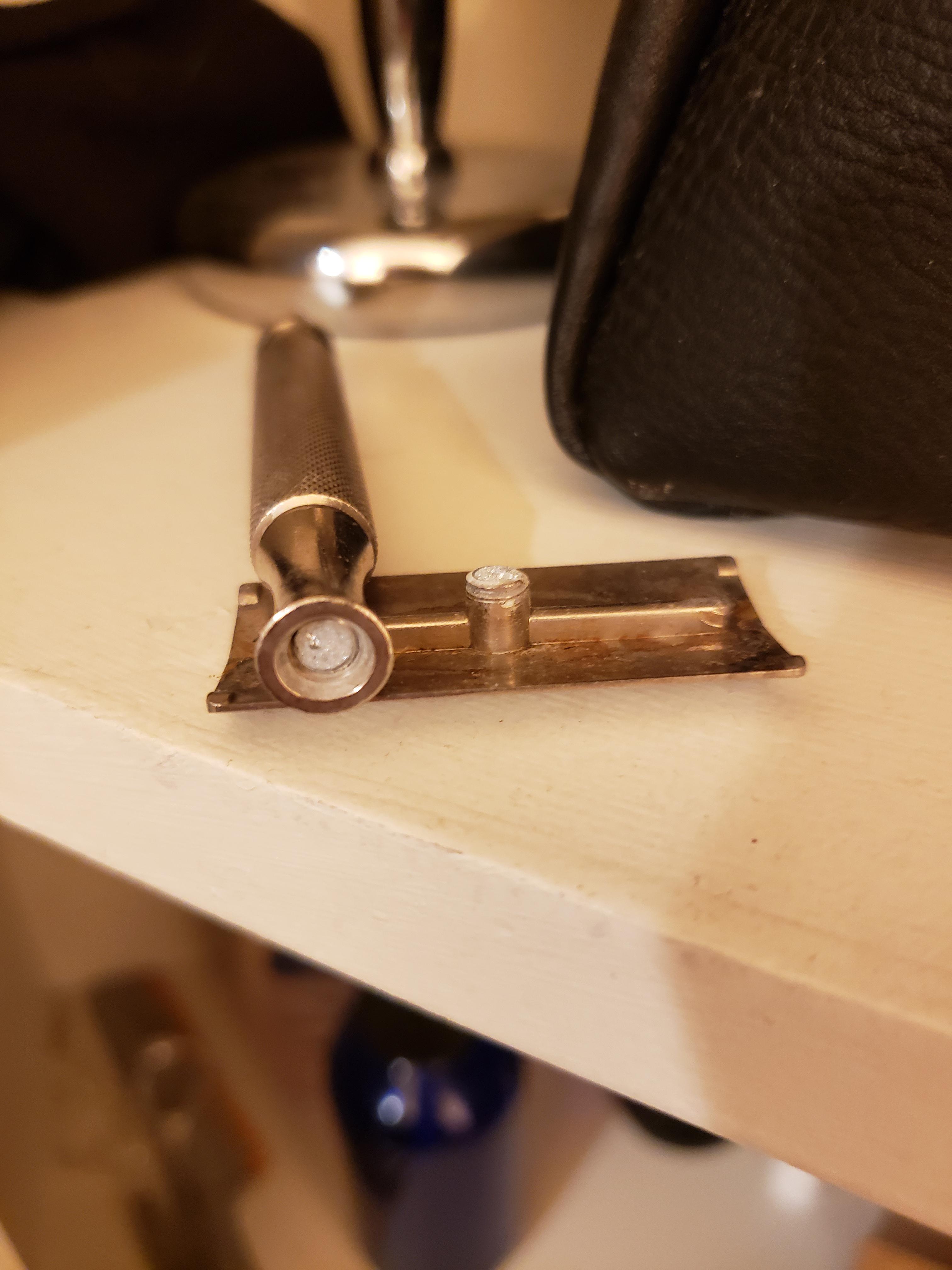 Dropped my old Gillette safety razor and the screw fixture that holds