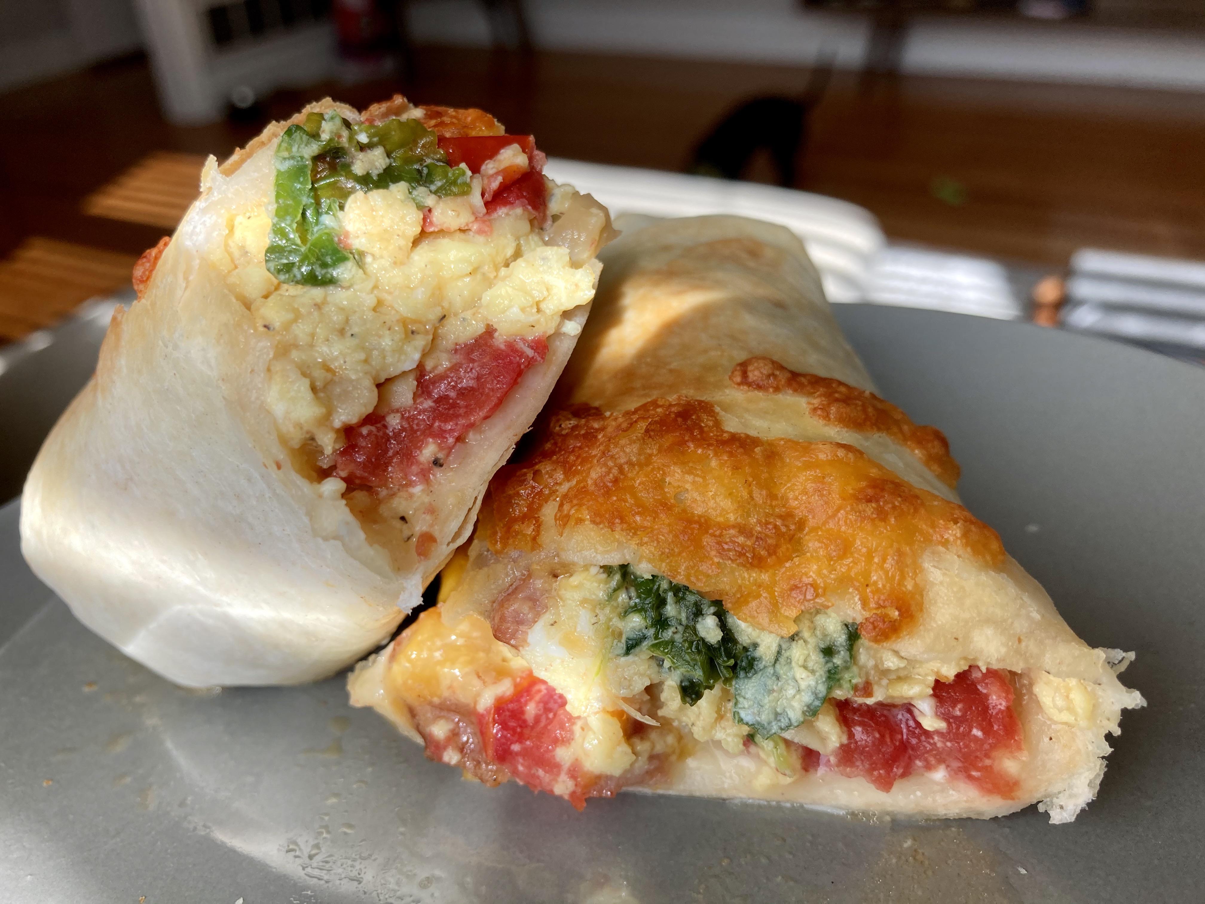 Breakfast burrito 🌯 w/home grown kale, tomatoes, and onions! So simple