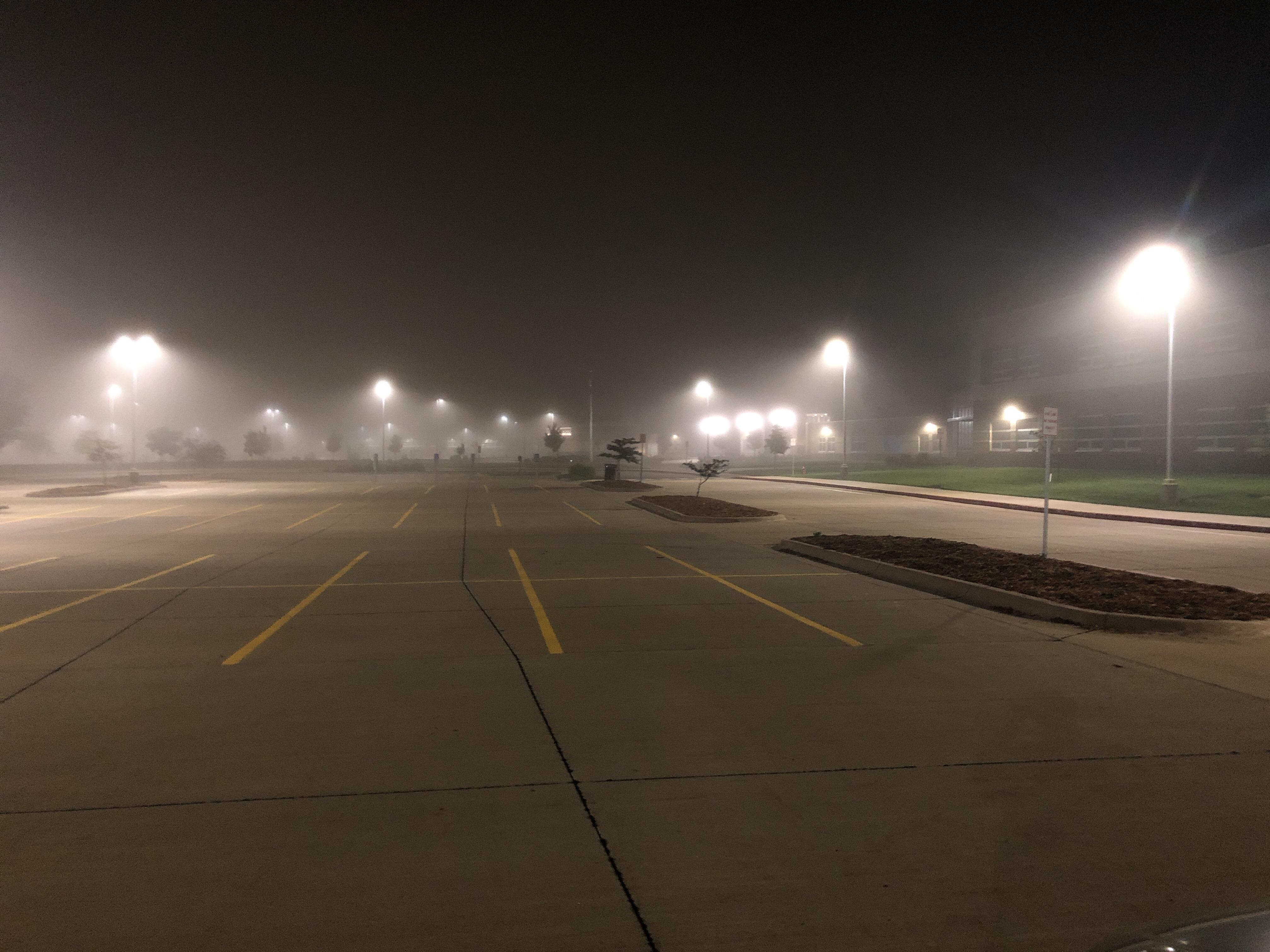 School parking lot during a summer night. r/LiminalSpace