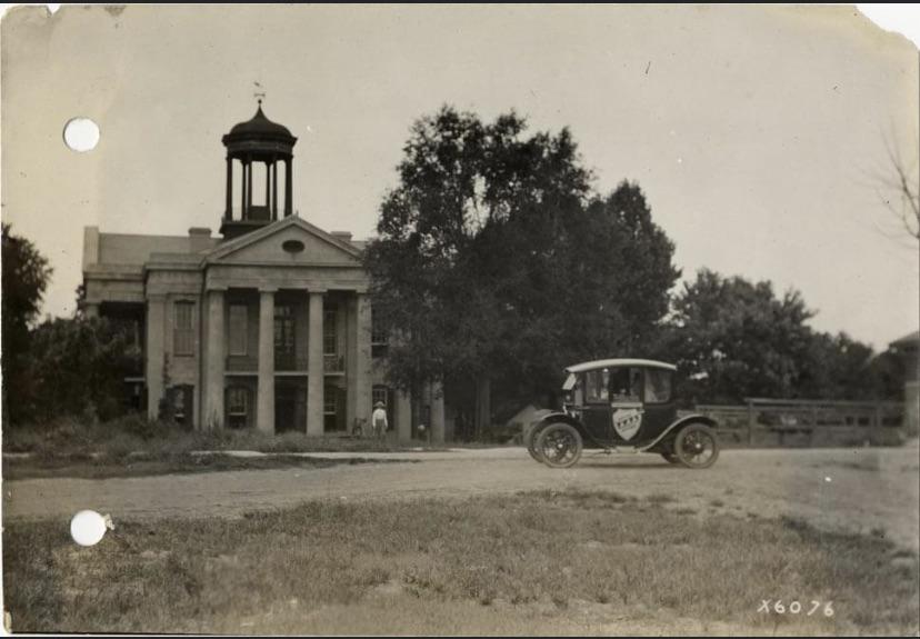 Flanders electric car parked in front of Hinds County courthouse