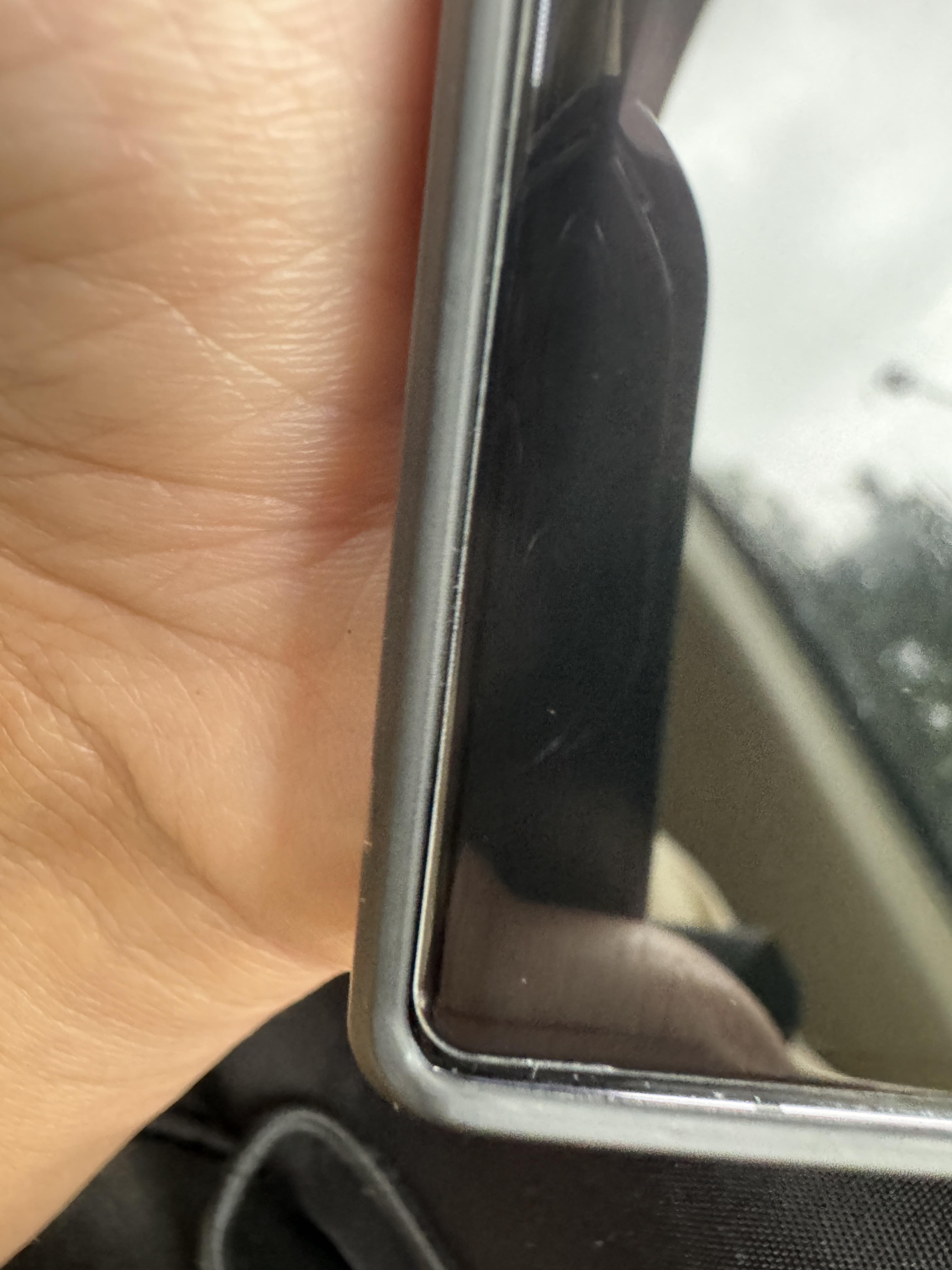 Any way to remove this speck of dust/particle from underneath the