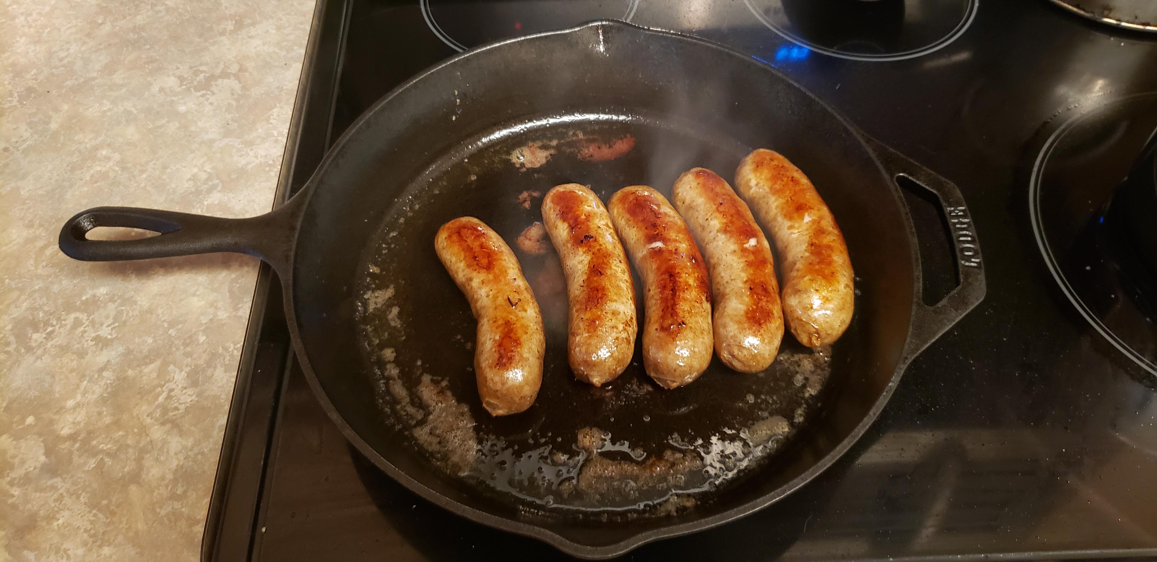 Beer Boiled Brats browned in cast iron. r/castiron