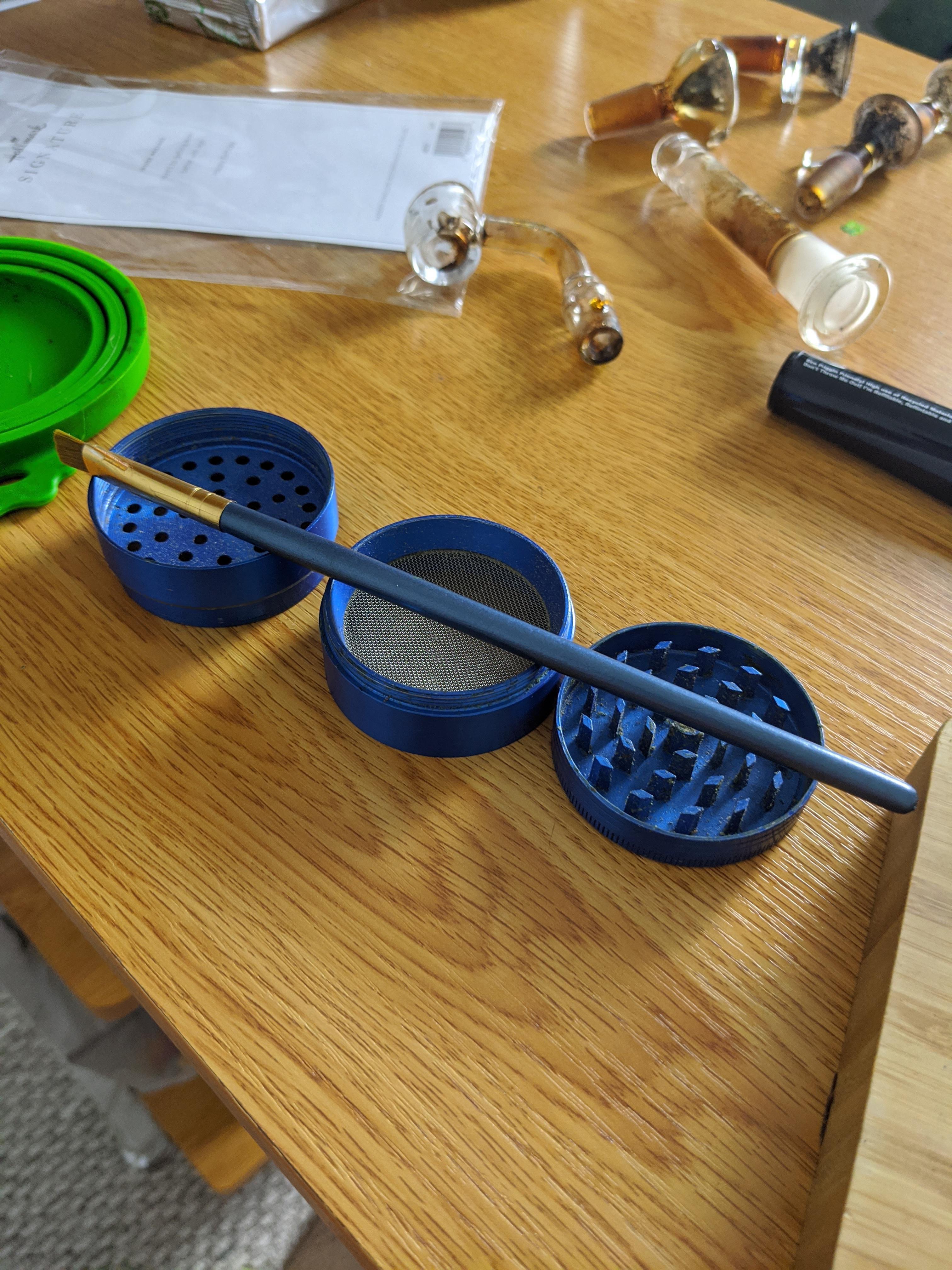 Just discovered a paint brush with the tips cut off (so it's firmer) is