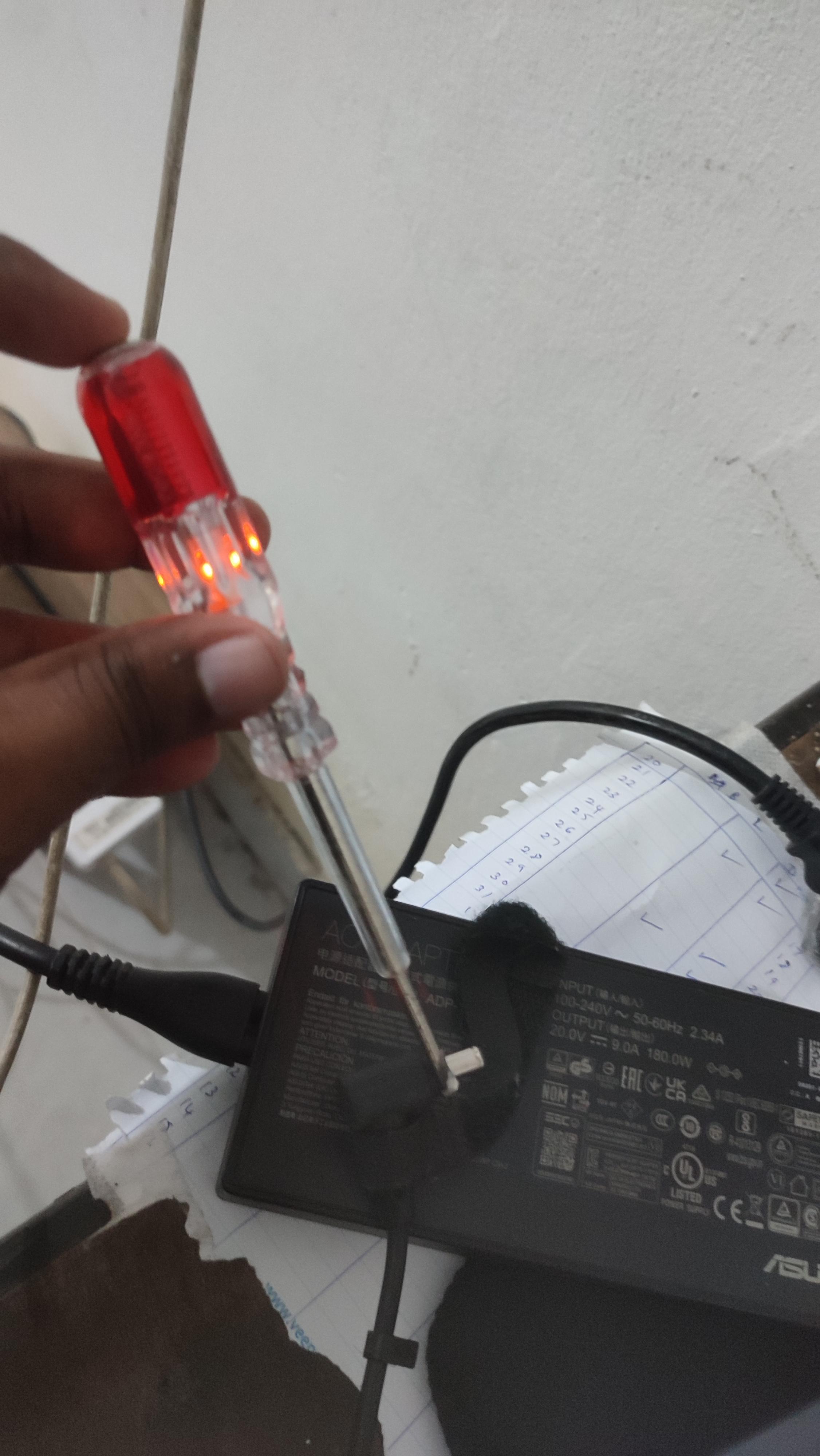 I was shocked by my laptop charger pin(230v) why this happened? Please