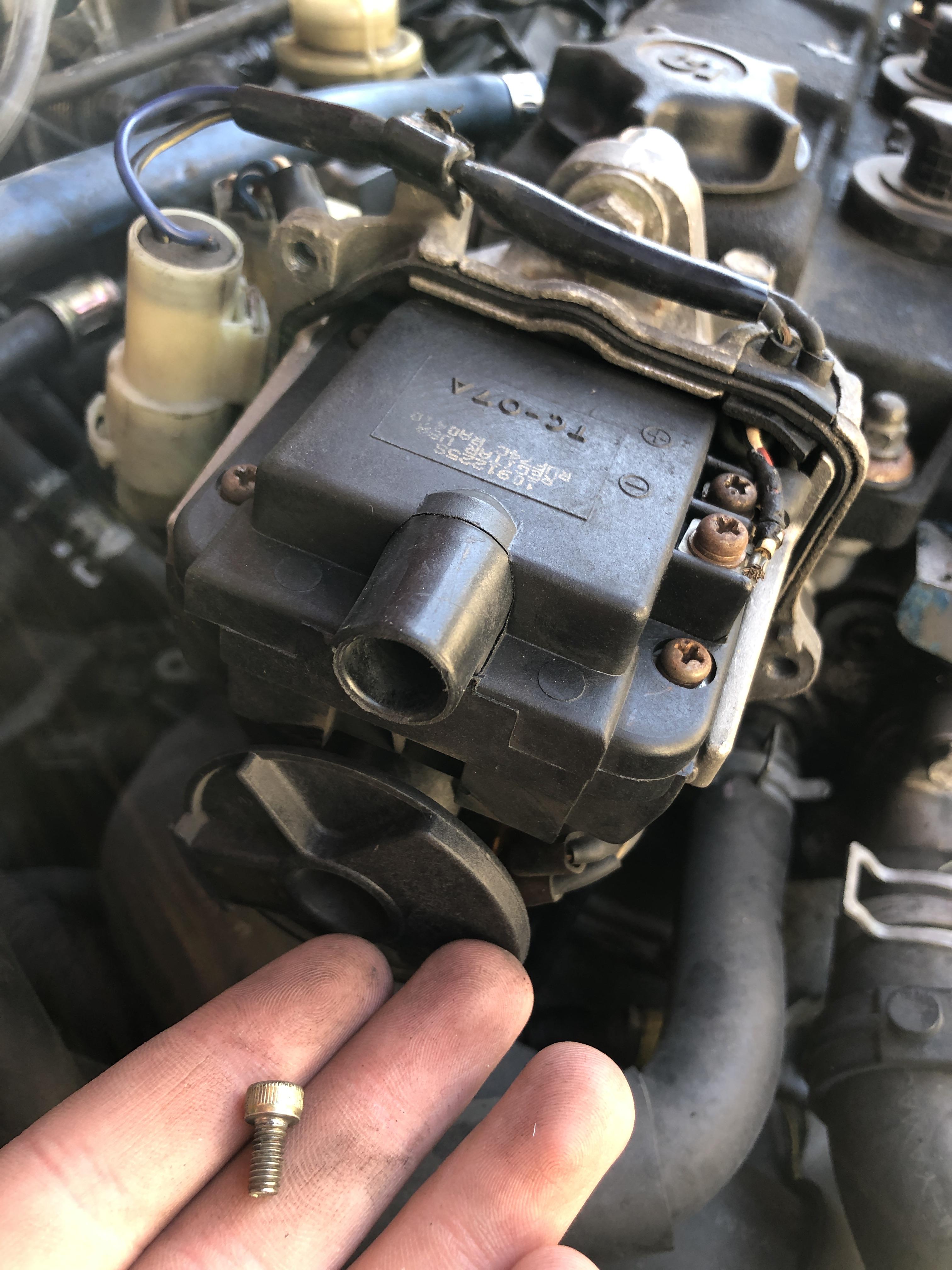 Where did this screw come from in my distributor cap? Is it important