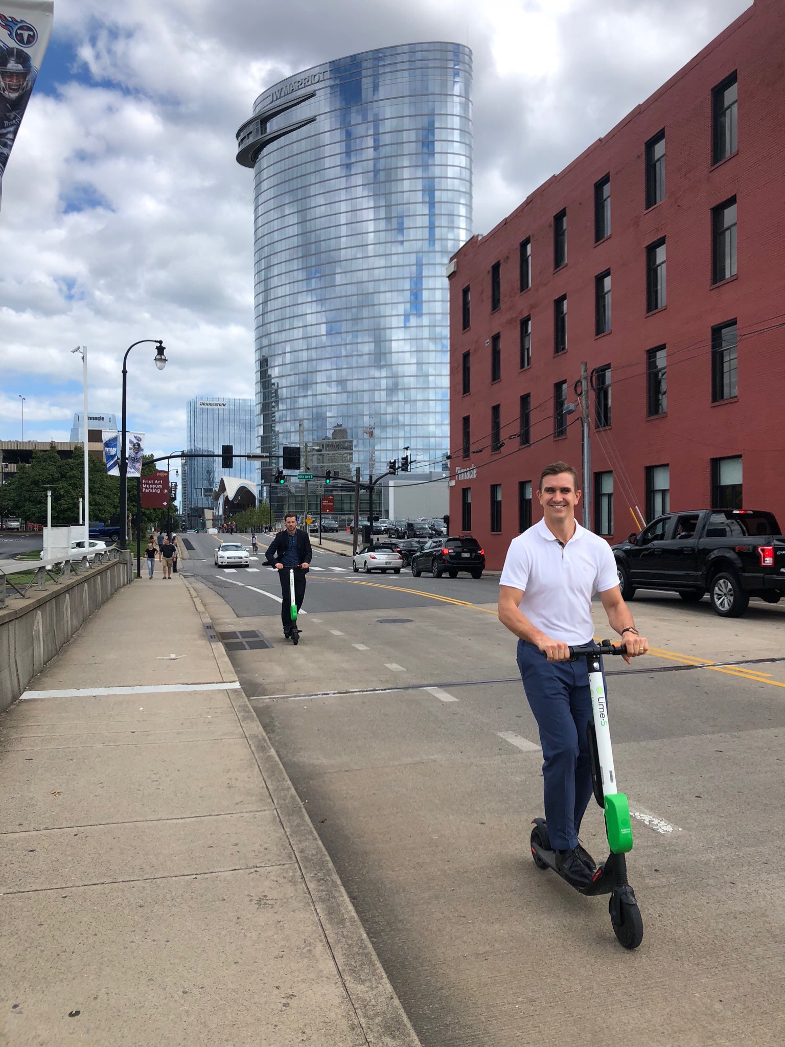 Flames riding around Nashville on electric scooters for rent. r