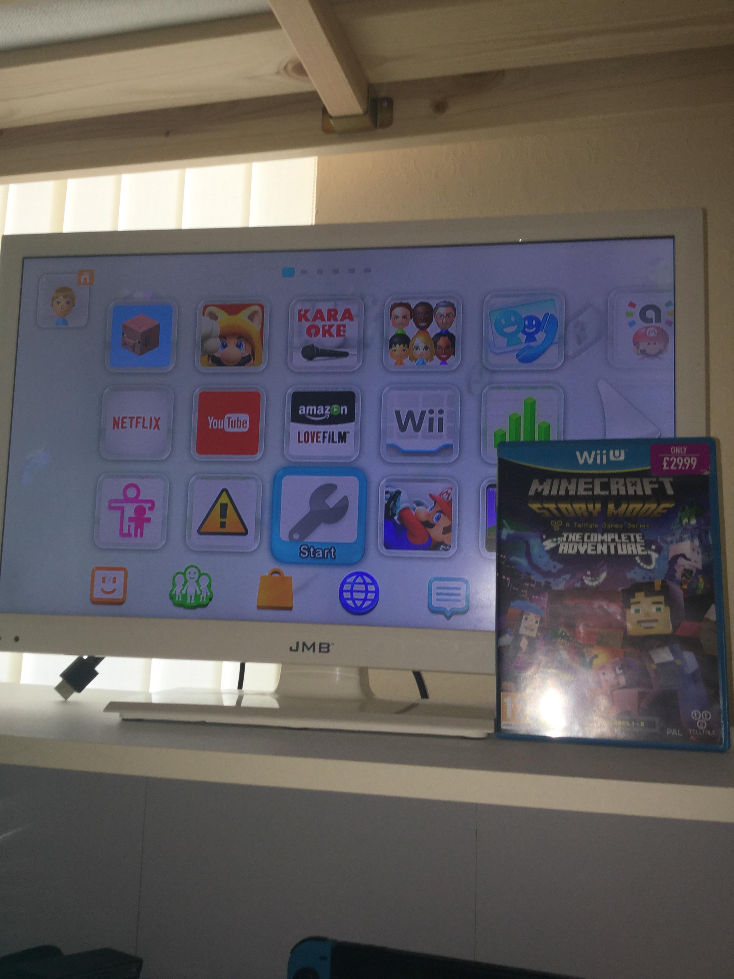 How do I download a physical game onto my Wii u? Minecraft Story mode