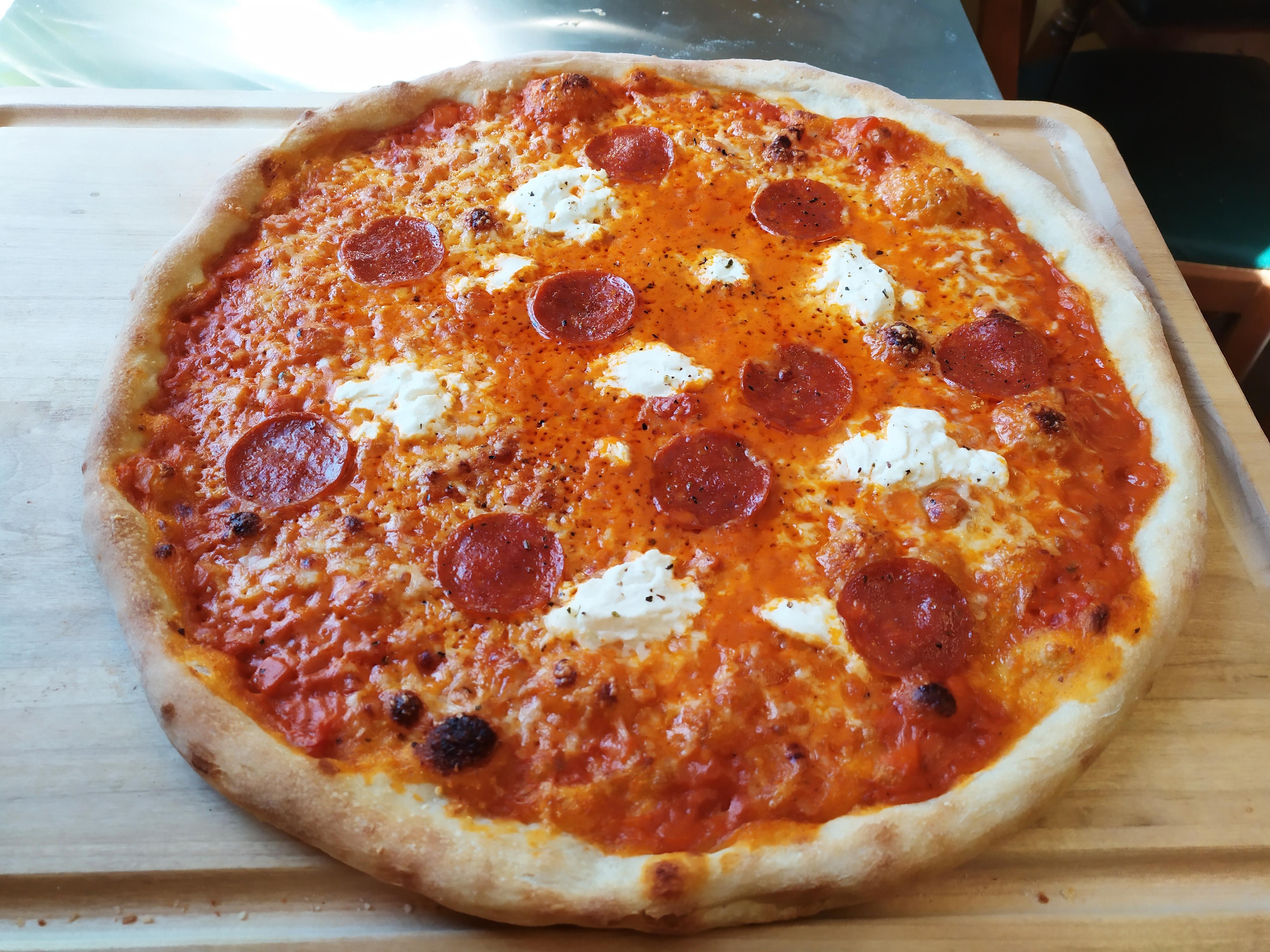 Handmade 16" vodka sauce, pepperoni, ricotta, and parmesan pizza with