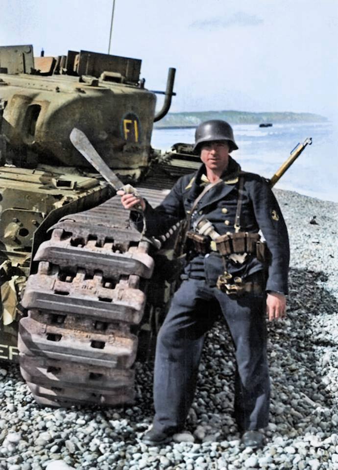 German Kriegsmarine Bootsmann wielding a machete knife taken from the