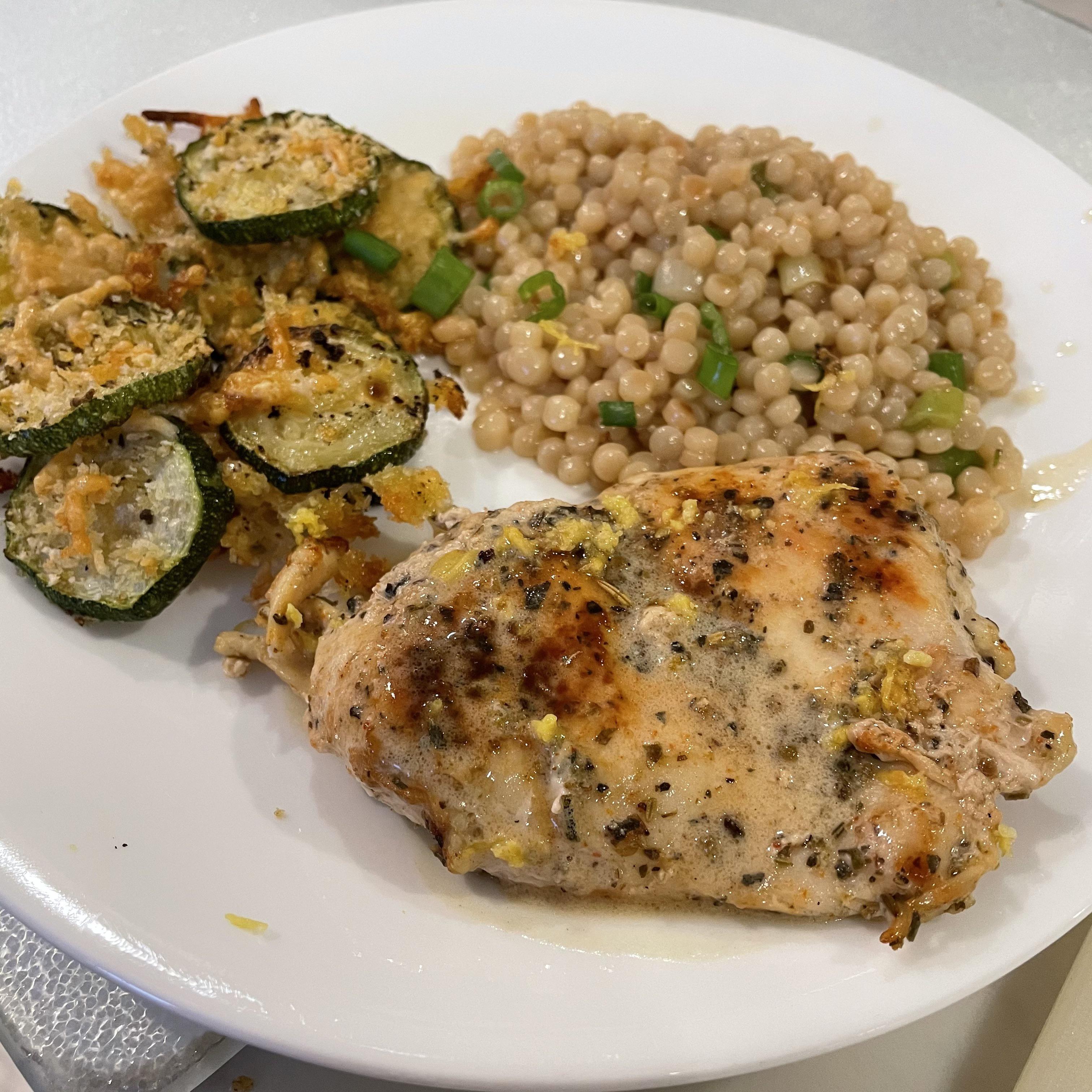 Creamy Lemon Butter Chicken with Parmesan Zucchini rounds and scallion