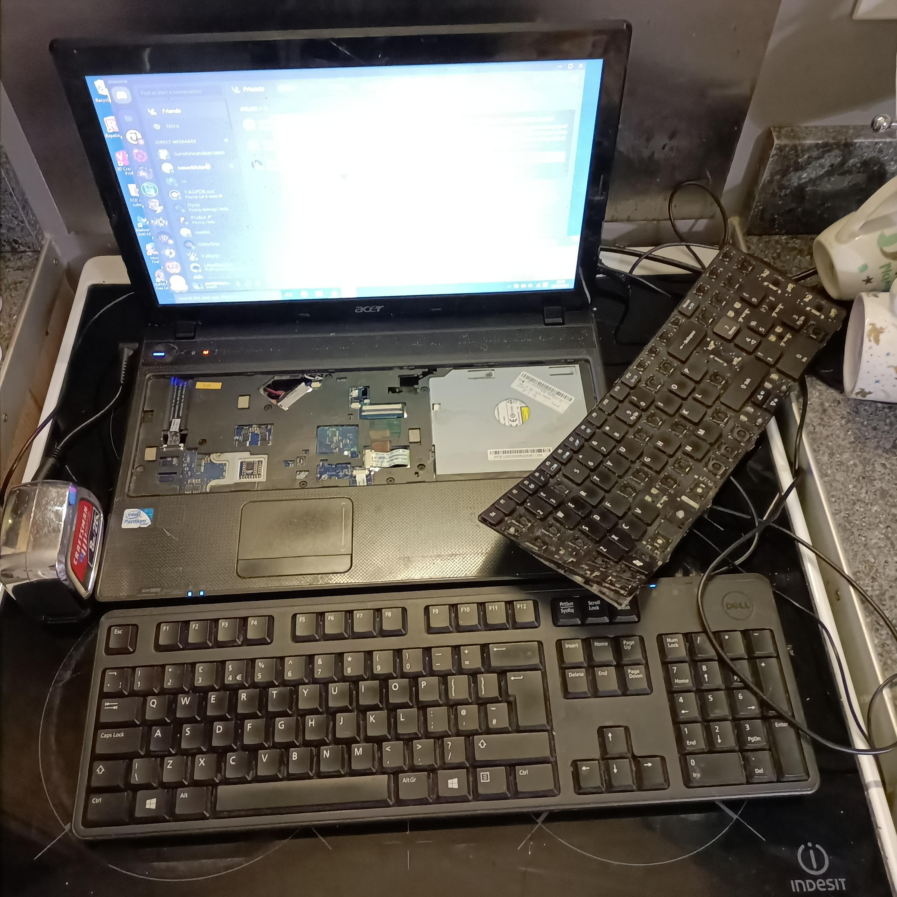 Laptop keyboard won't stop repeating random letters and pressing random