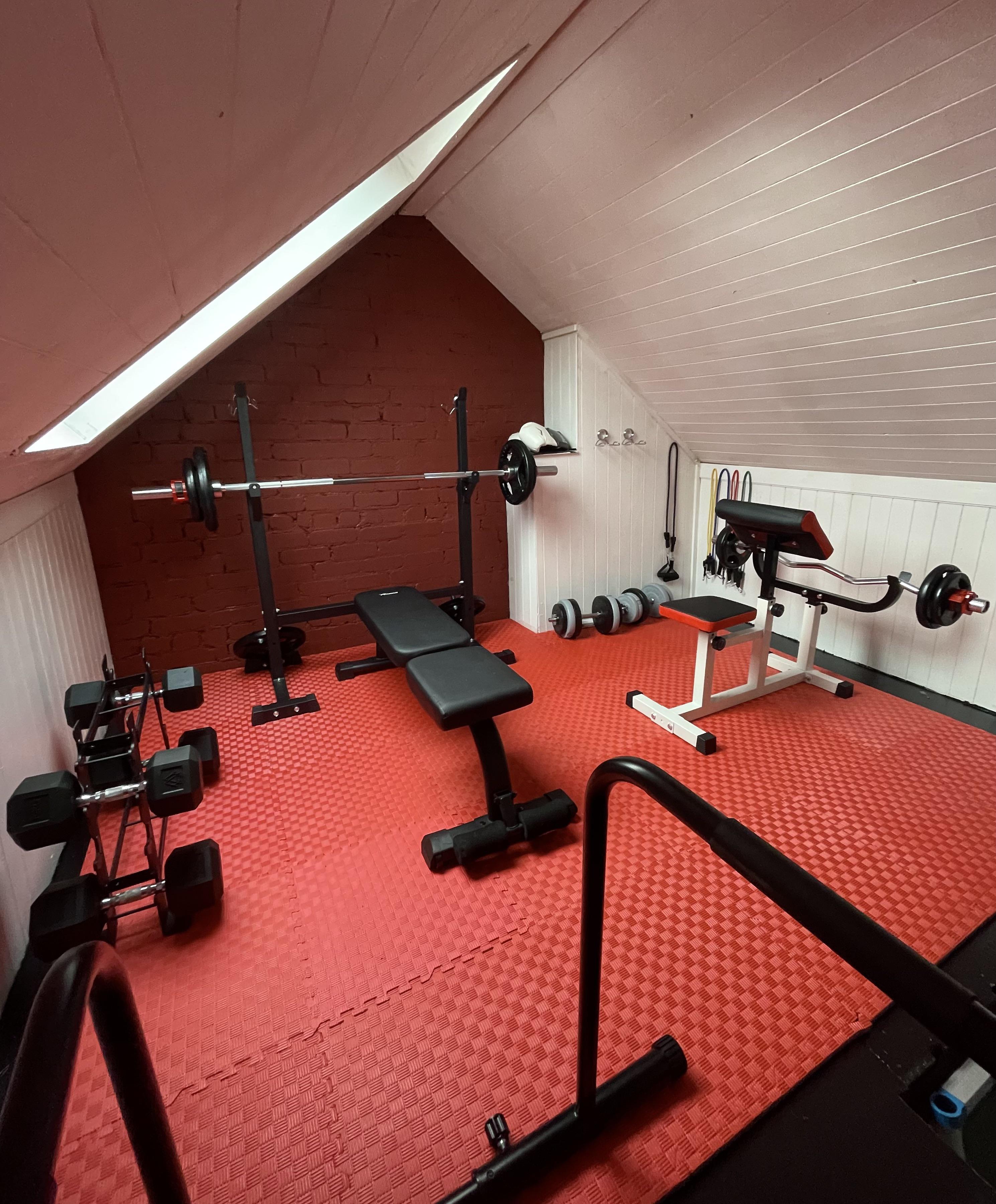 Converted our loft into a small gym. All basic budget equipment but