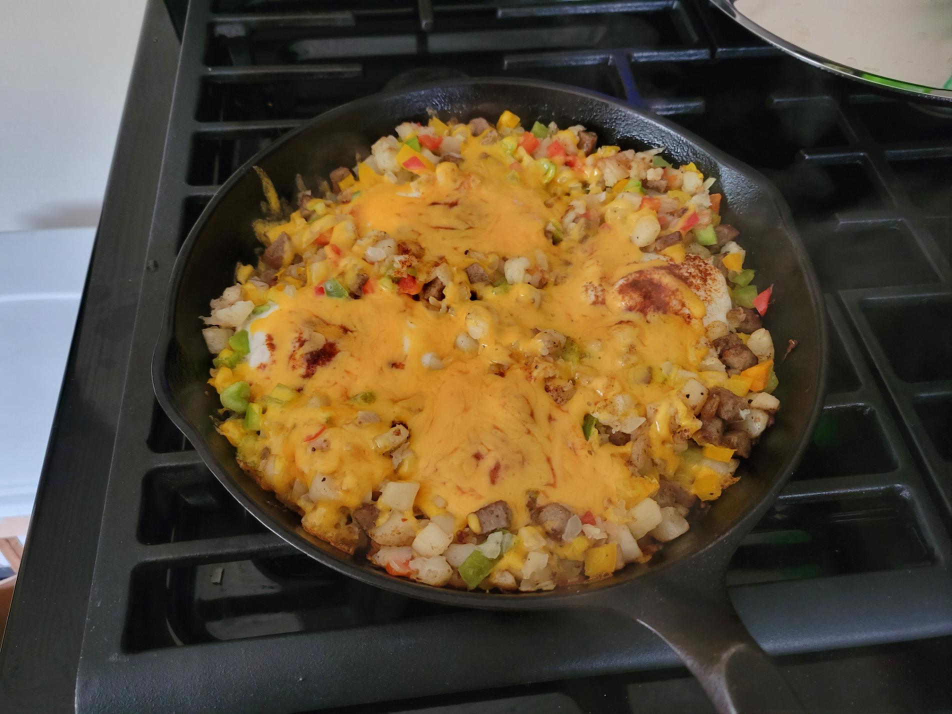 [Homemade] Breakfast skillet Hash browns, sausage, eggs, veggies, cheese r/food