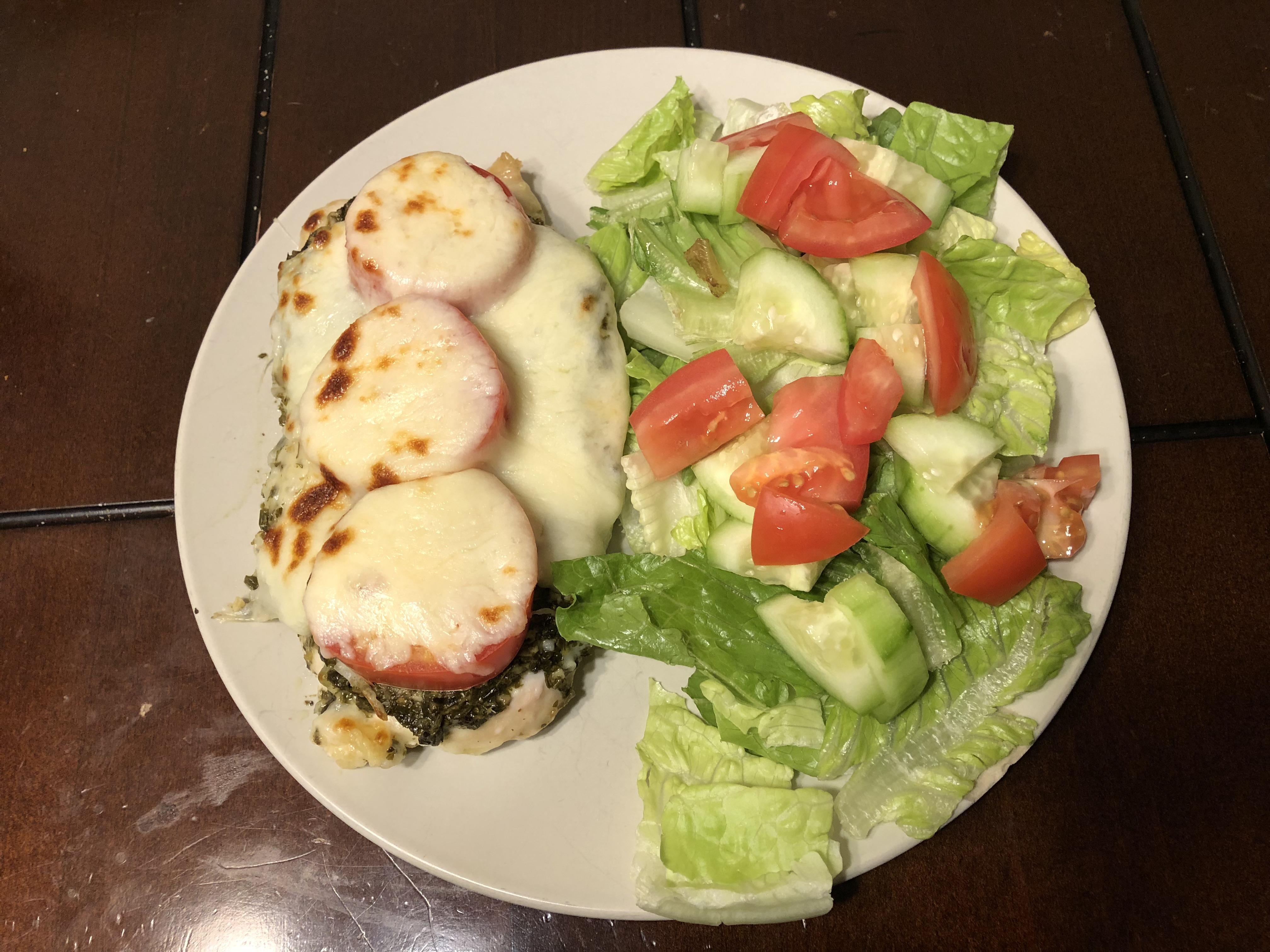 Dinner tonight; garlic pesto chicken smothered in mozzarella and tomato