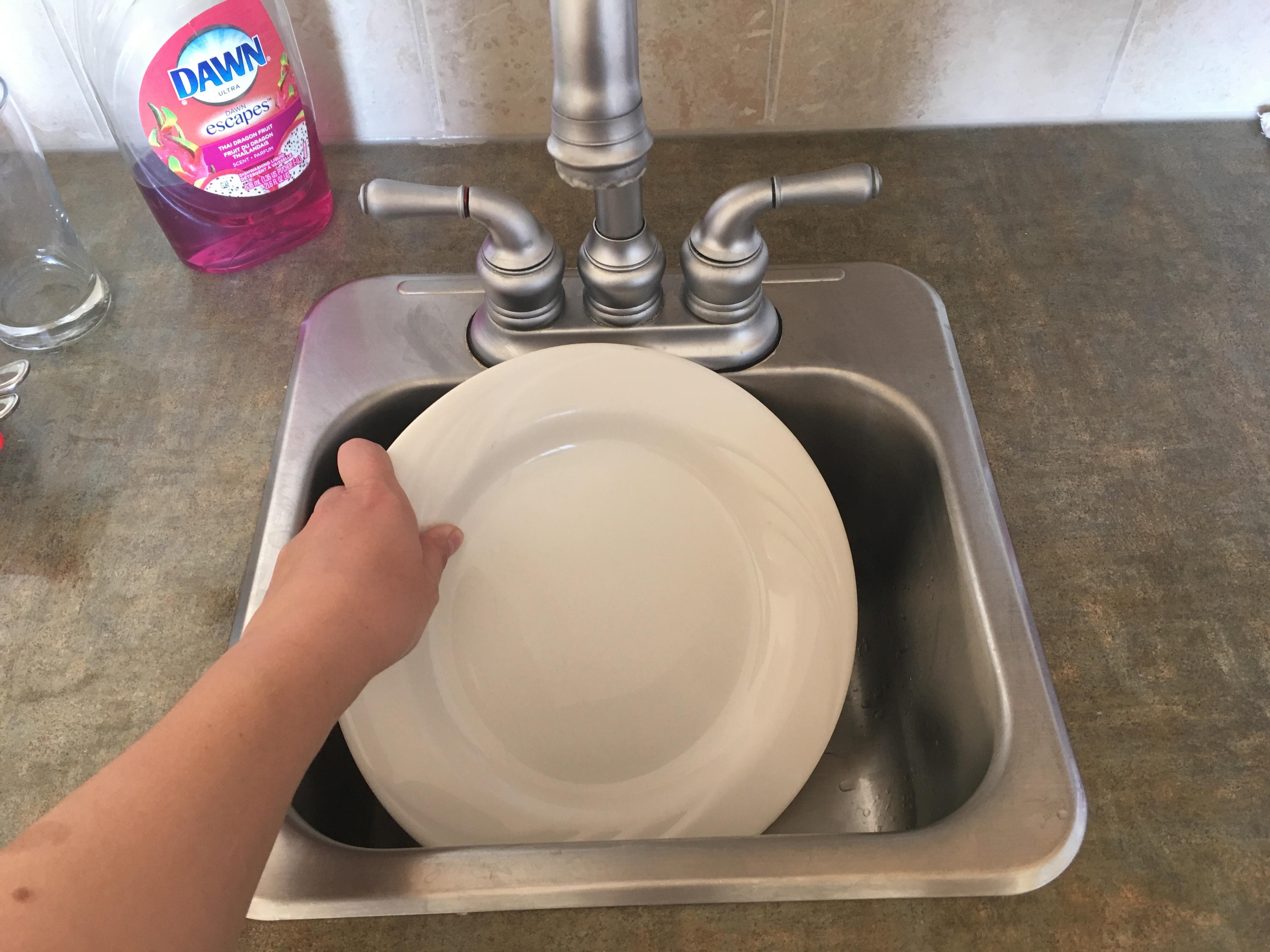 This tiny kitchen sink that doesn't even fit a regular dinner plate