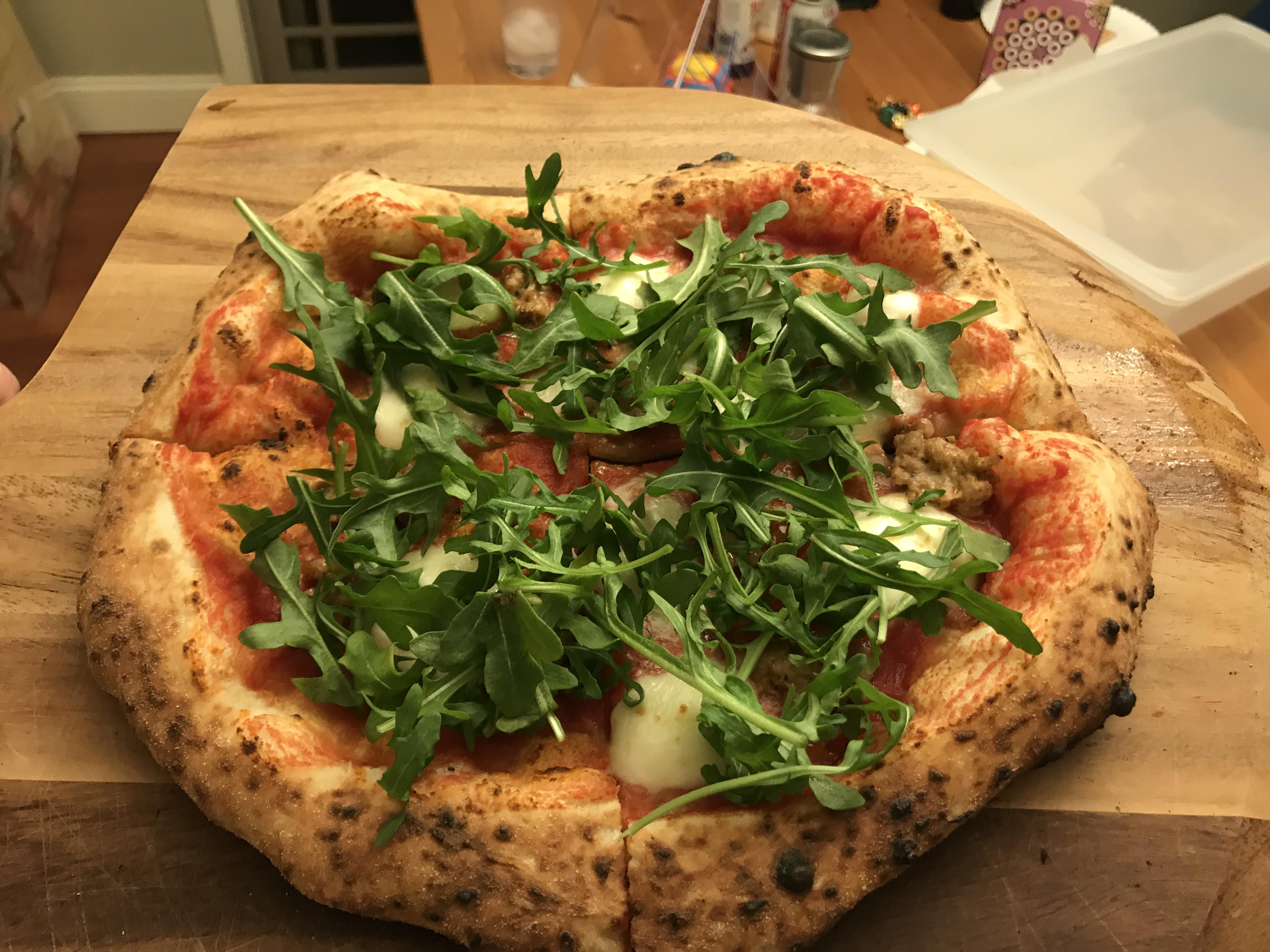 I made an arugula and spicy Italian sausage pizza. Neapolitan dough recipe from the Pizza Bible