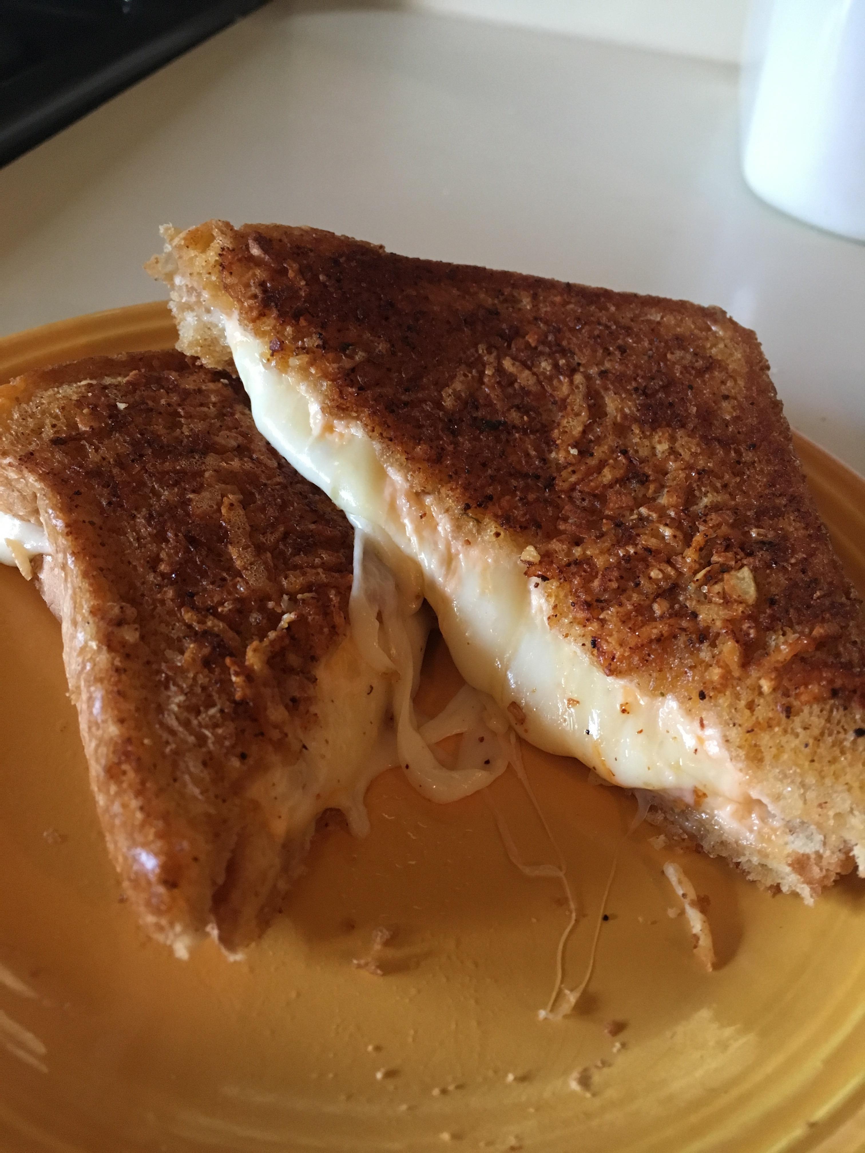 Muenster, mystery cheese, sharp cheddar, and cream cheese on wheat with
