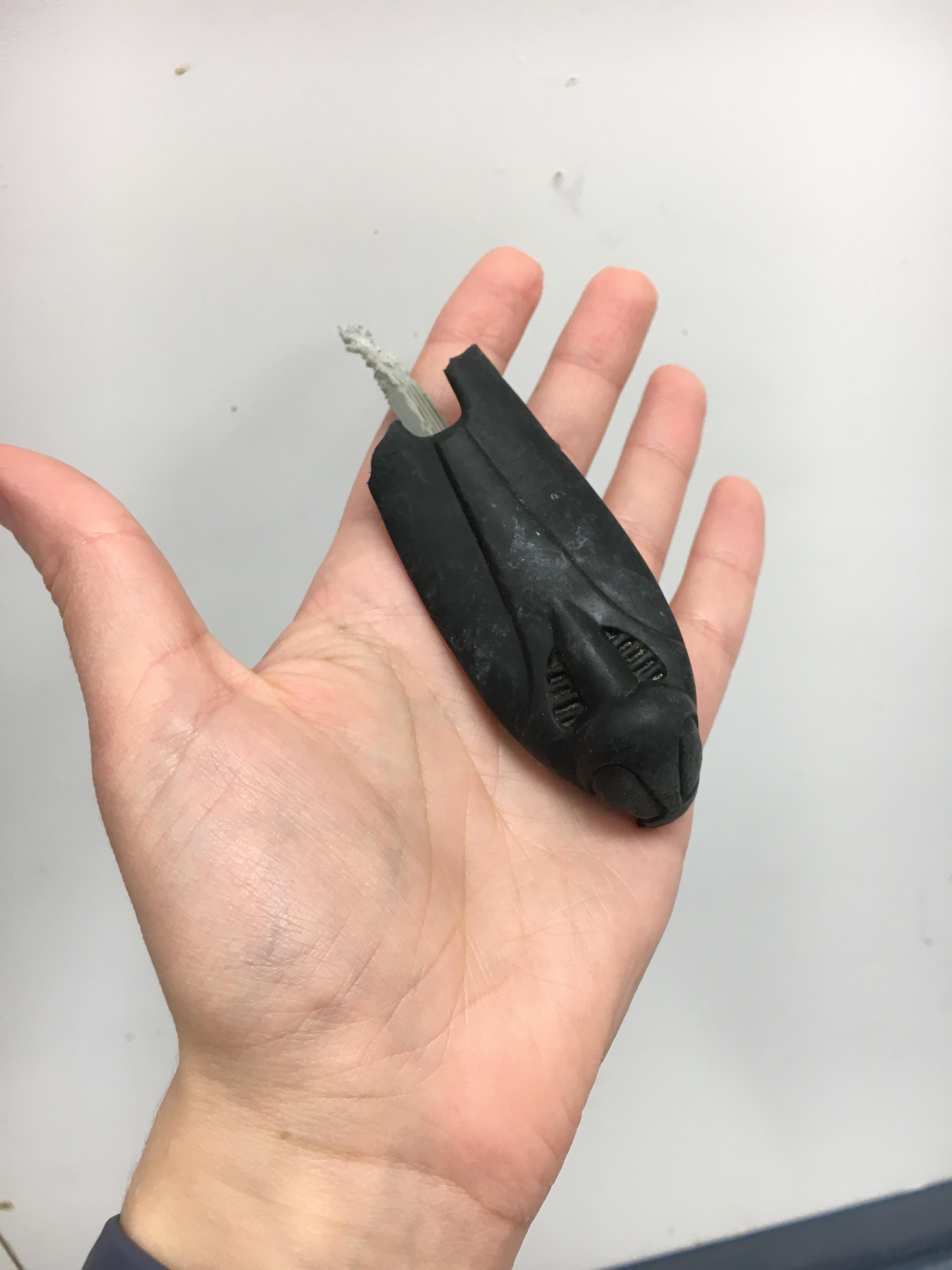 What did this dog chew up? Plastic, looks like it’s shaped like a cockroach r/whatisthisthing