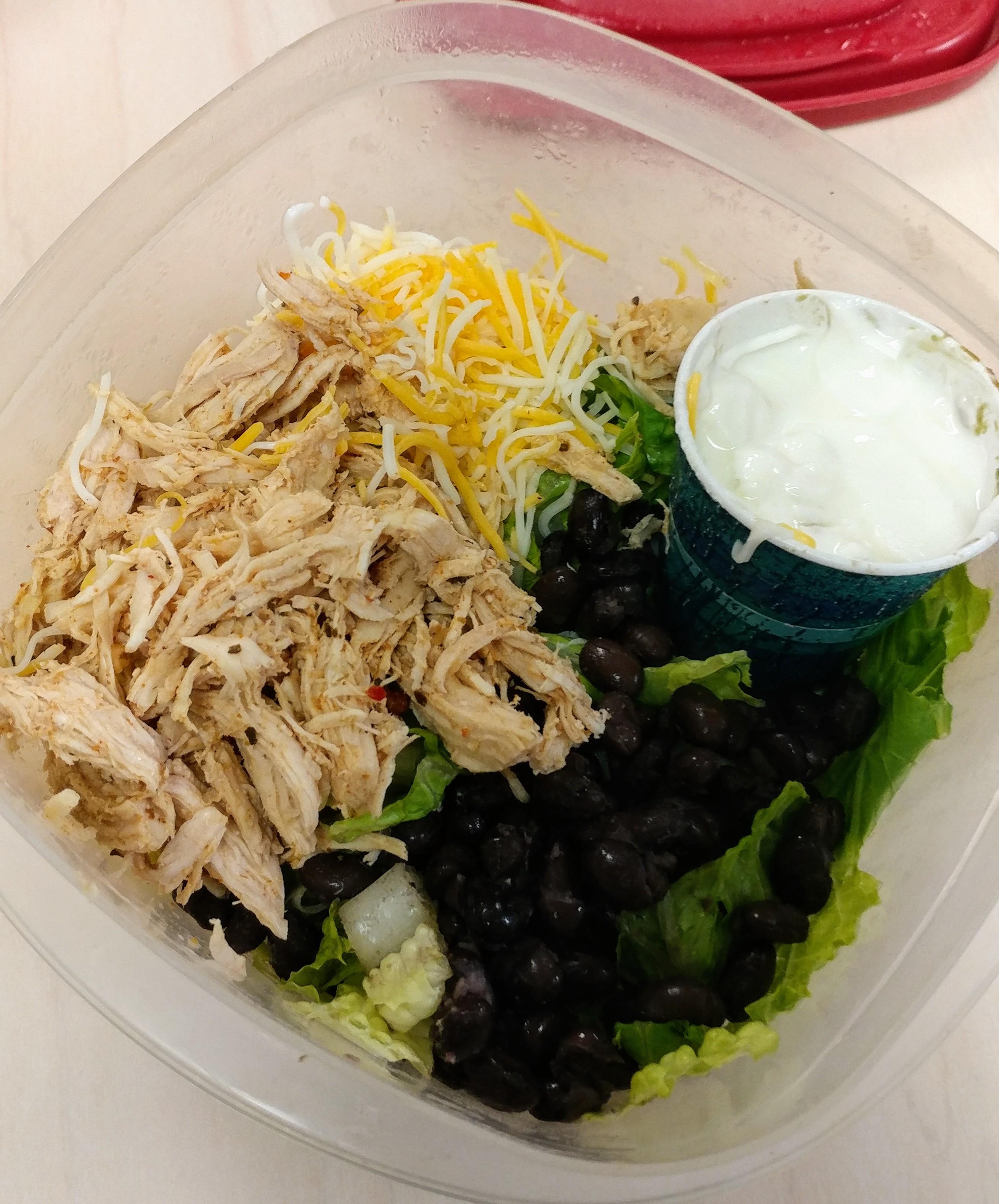 Chicken burrito bowlabout 350 calories. And that little dixie cup has