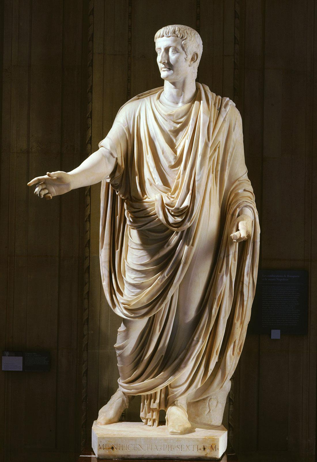 A Roman marble statue of the Emperor Tiberius wearing a toga. From Rome