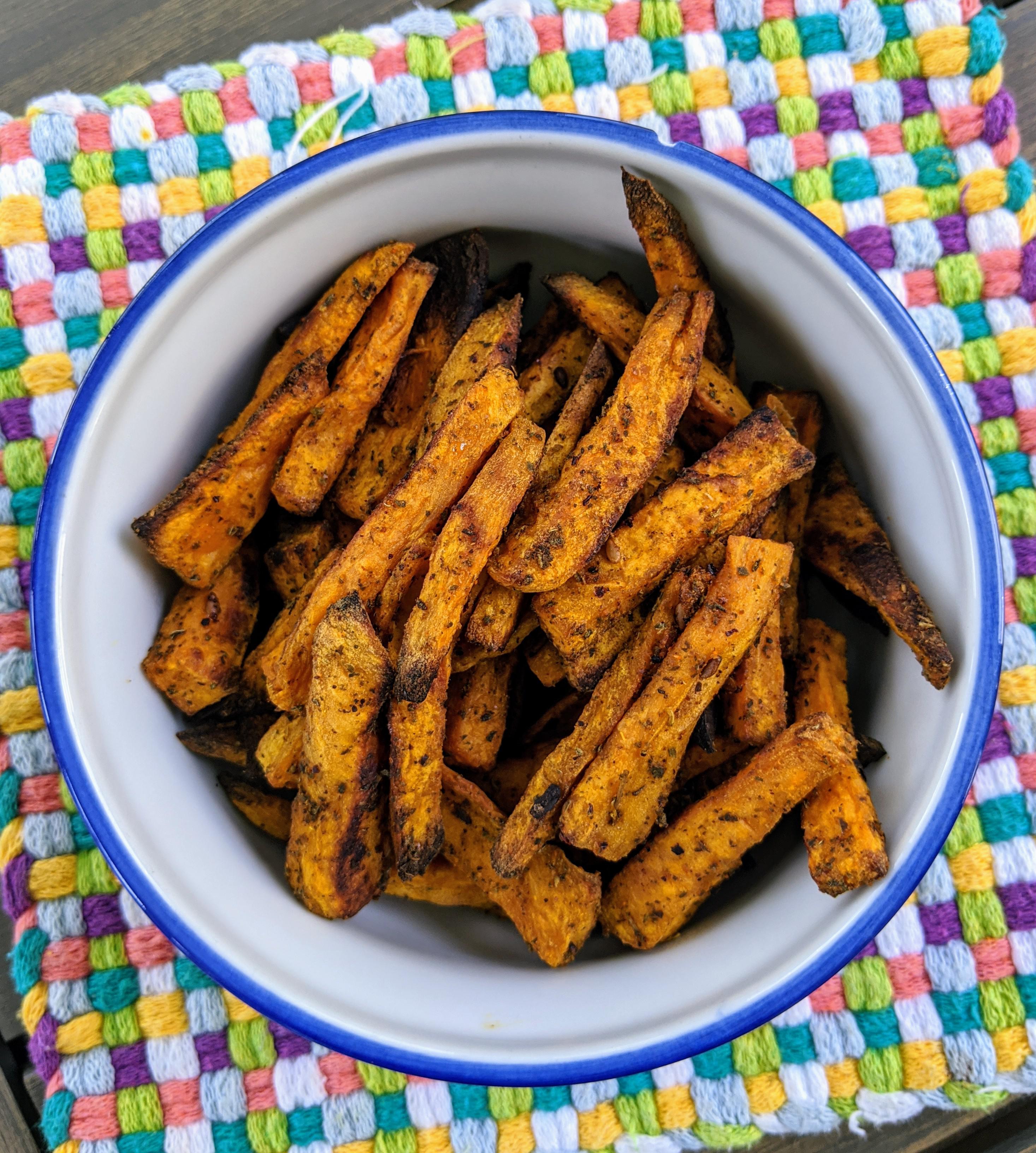Baked sweet potatoes. Seasoned with olive oil, salt, chilli powder, and