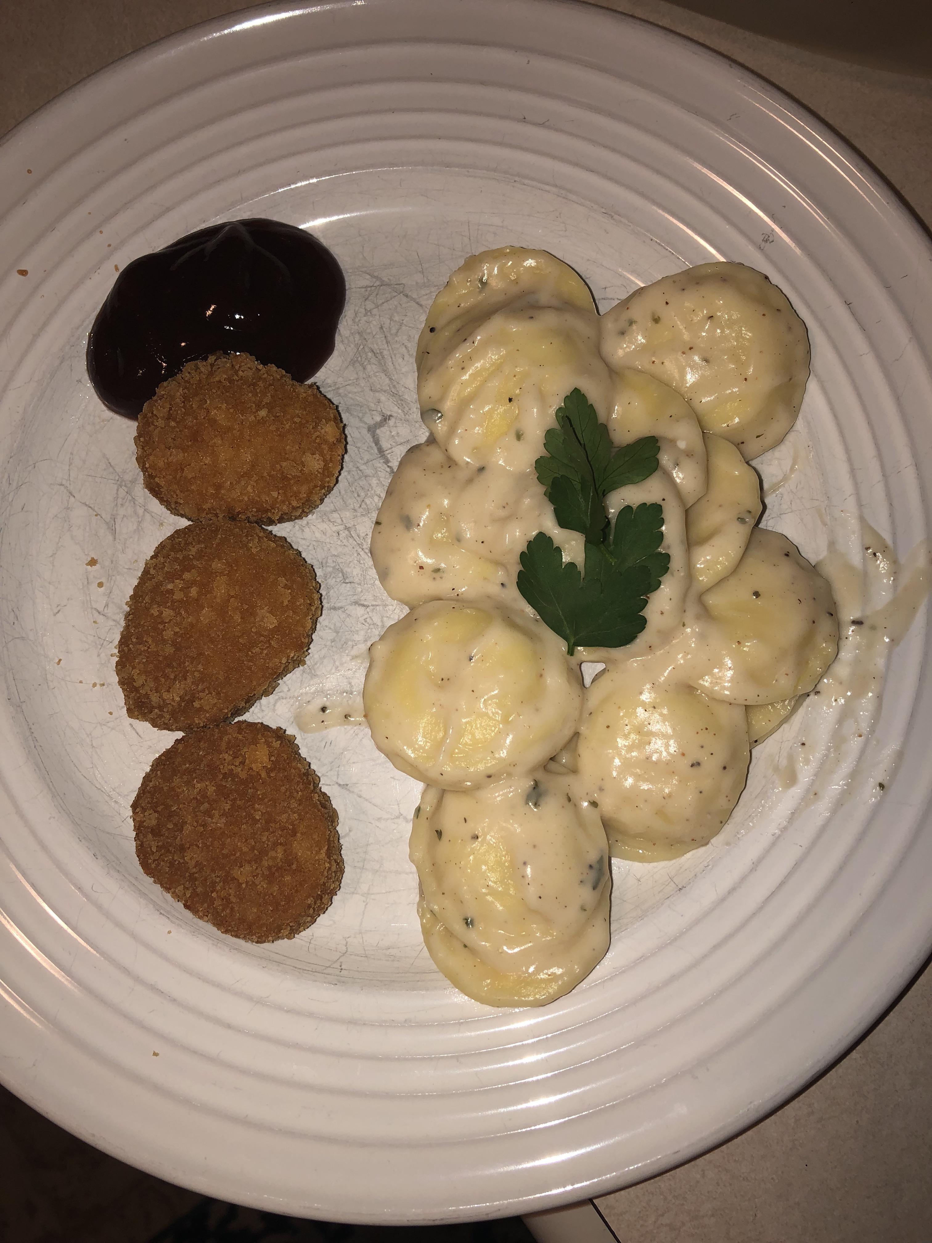 Frozen winco ravioli, jar Alfredo with some added spices and topped